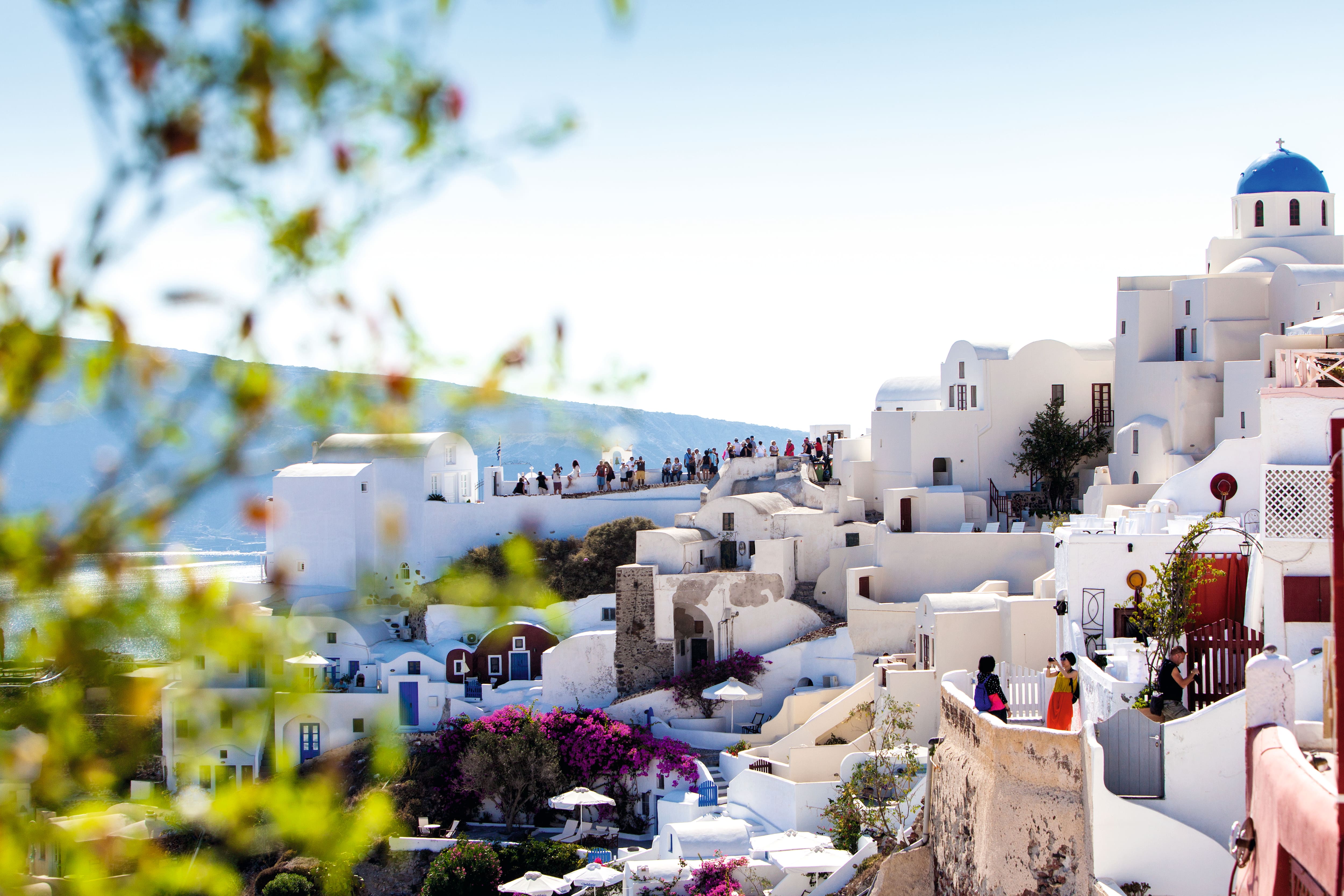 Beautiful view of picturesque town of Thira, caldera and volcano on the Mediterranean Sea