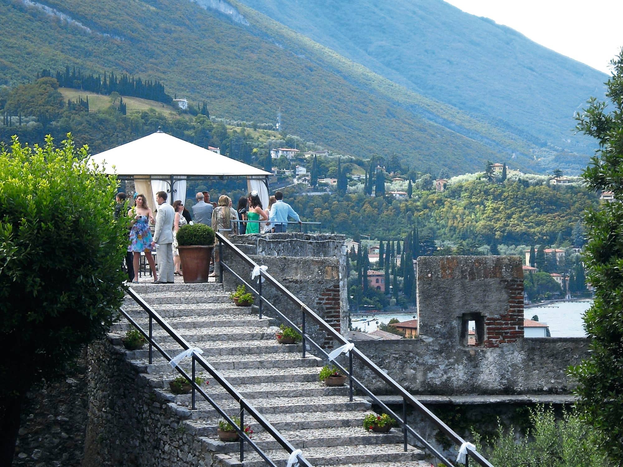 A wedding ceremony set-up on the castle terrace of Malcesine Castle, Italy.