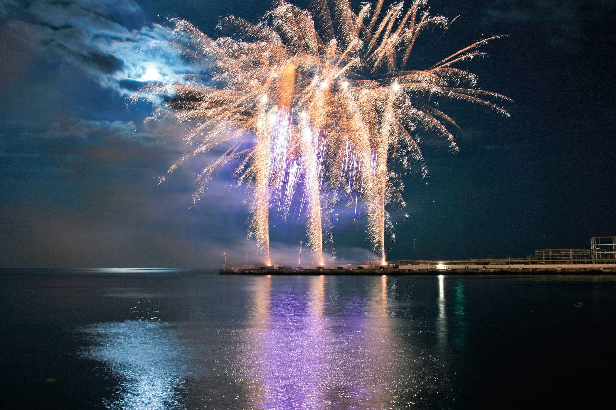 A fireworks show out at sea.