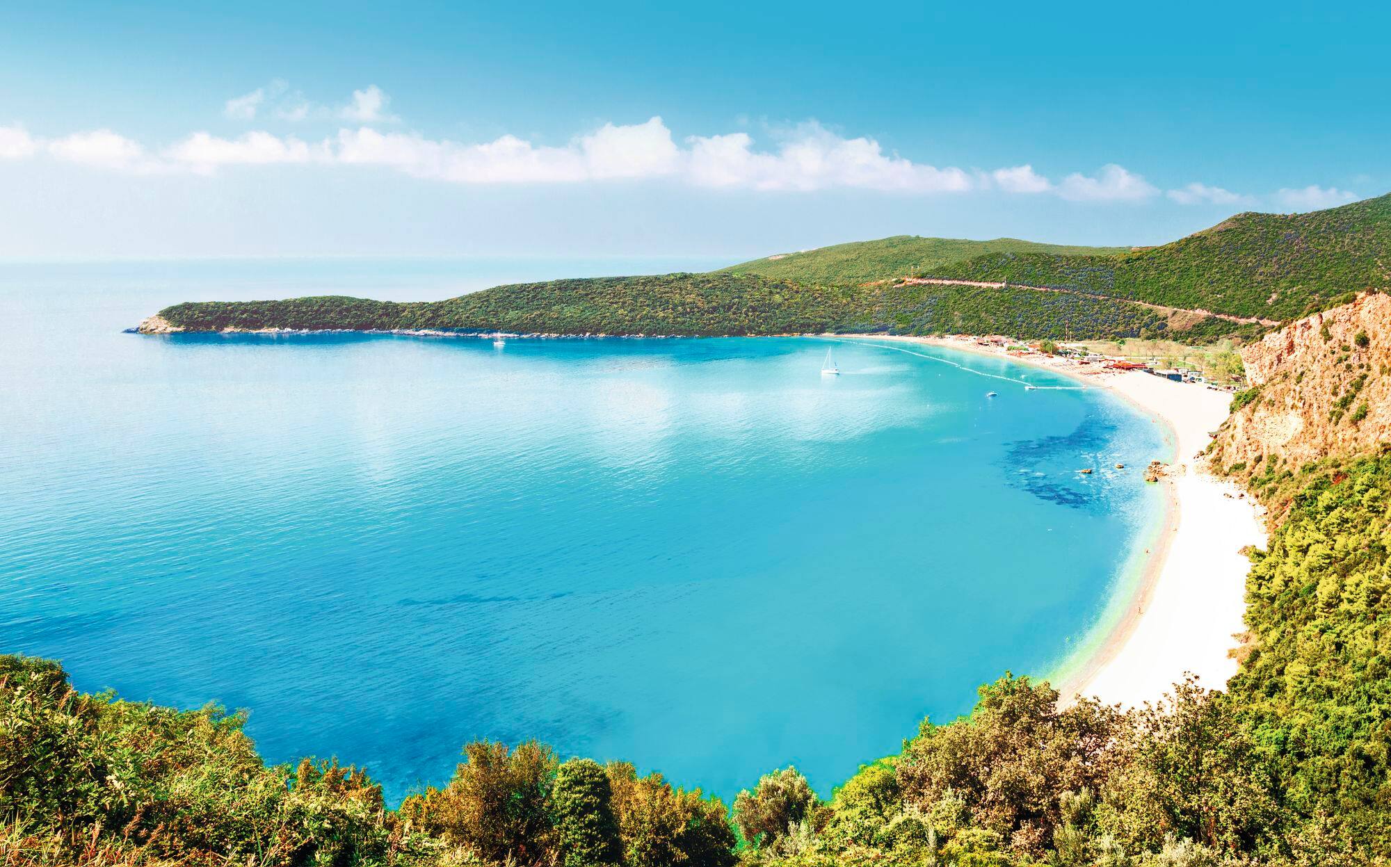 A curve-shaped sandy cove.