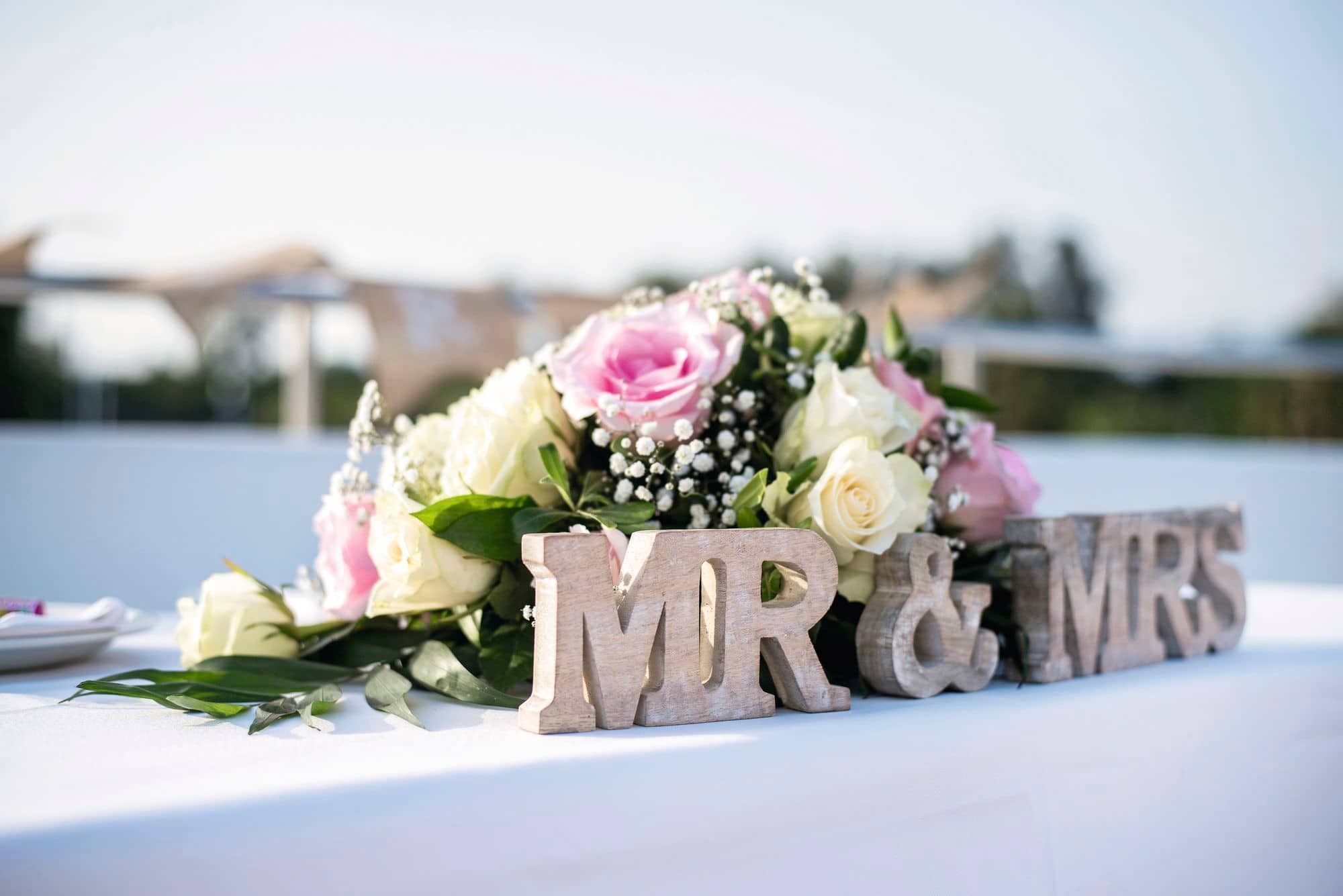 Mrs & Mrs written on a table at a wedding.