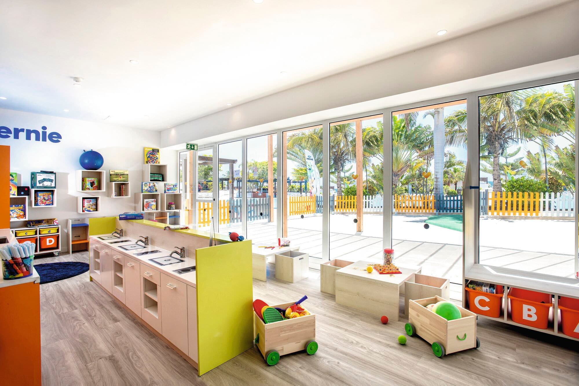 A kids' playroom with wooden toys.