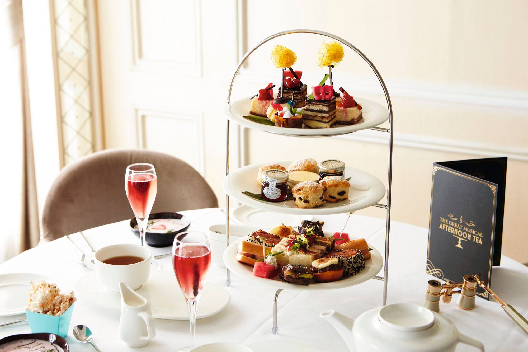 Afternoon tea set up on a dining table.
