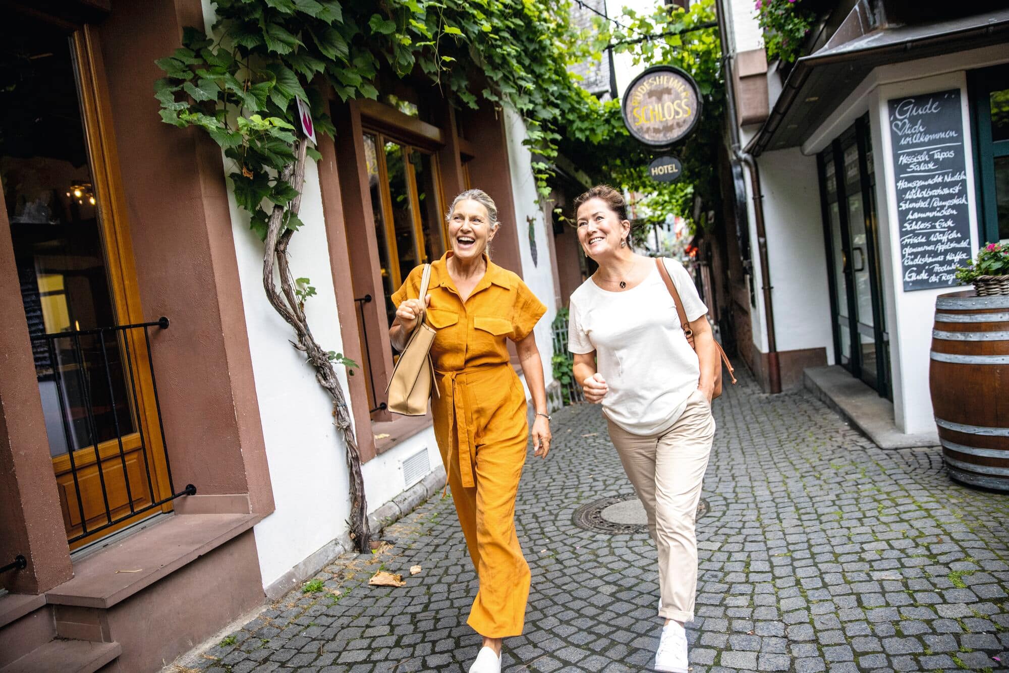 Friends exploring the side streets of an old town.
