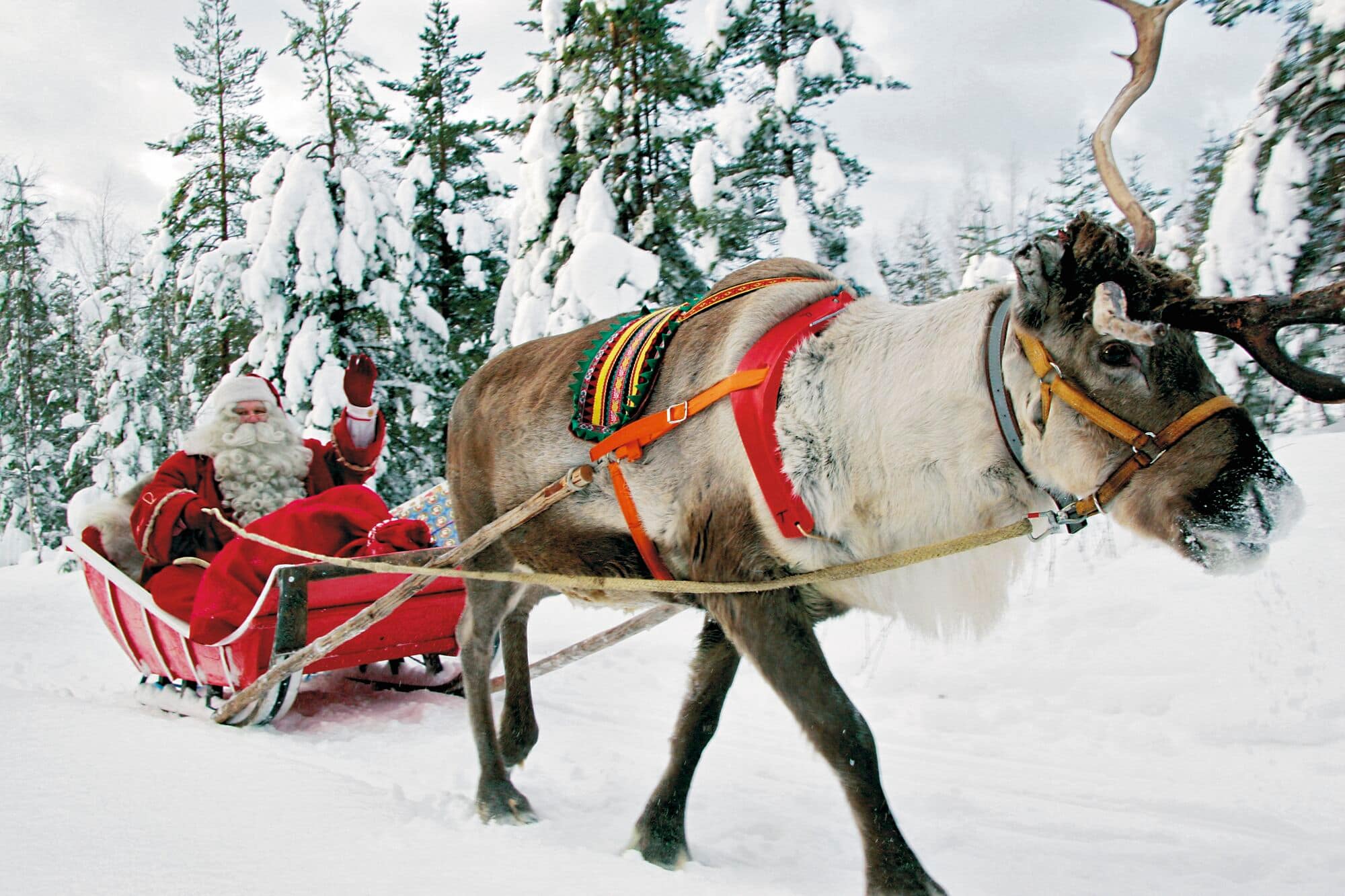 Santa waving on his sleigh.