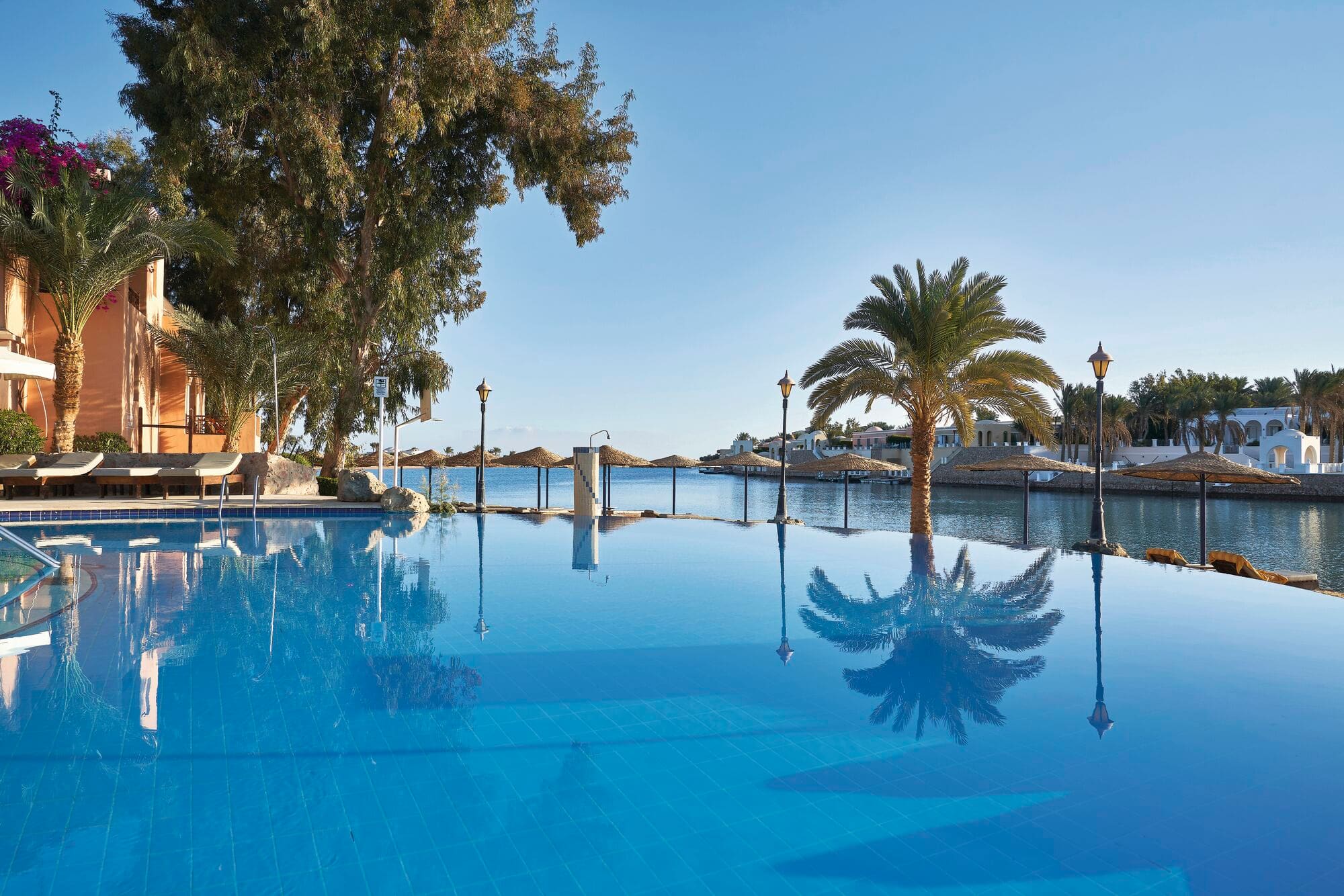 A luxury hotel pool with an infinity edge.