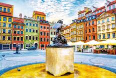 Fountain Mermaid and colourful houses on Old Town Market square in Warsaw, capital of Poland