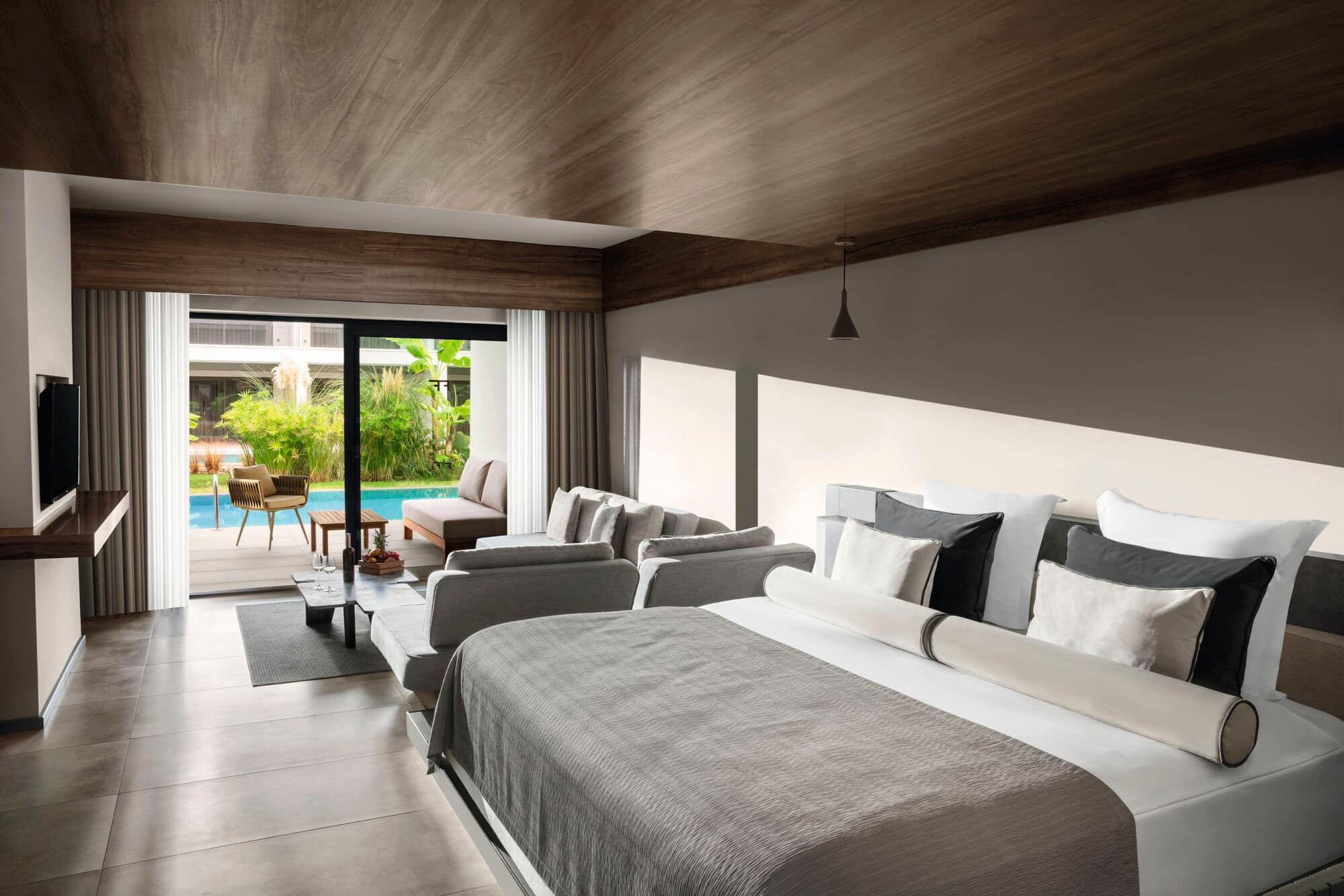 A swim-up room with a double bed and sofa-bed.