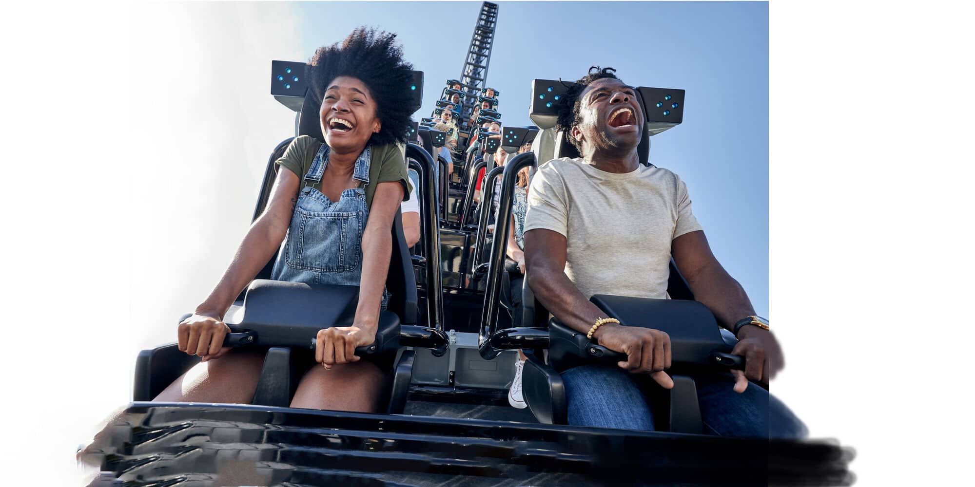 People laughing on a rollercoaster.
