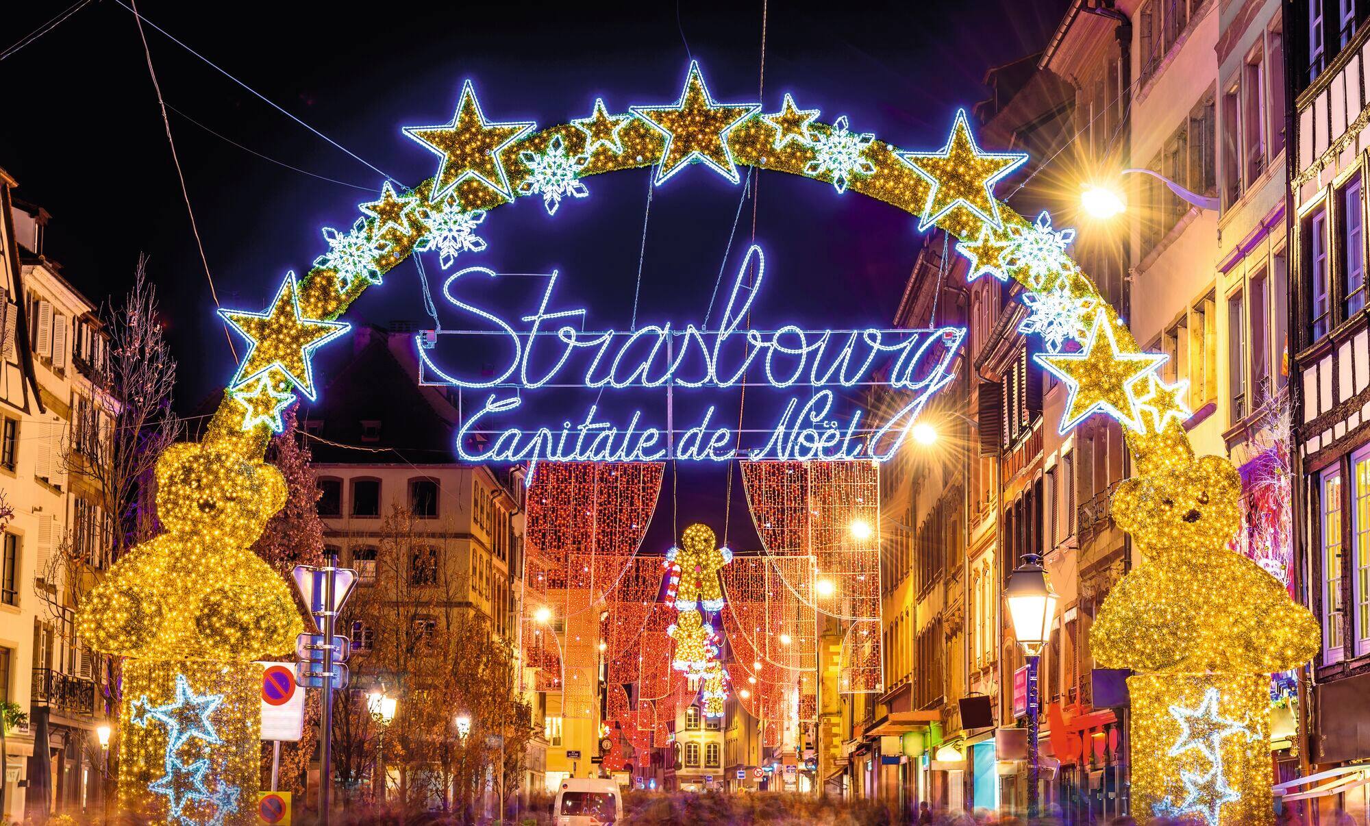 A  lit up entrance to the Strasbourg Christmas market.