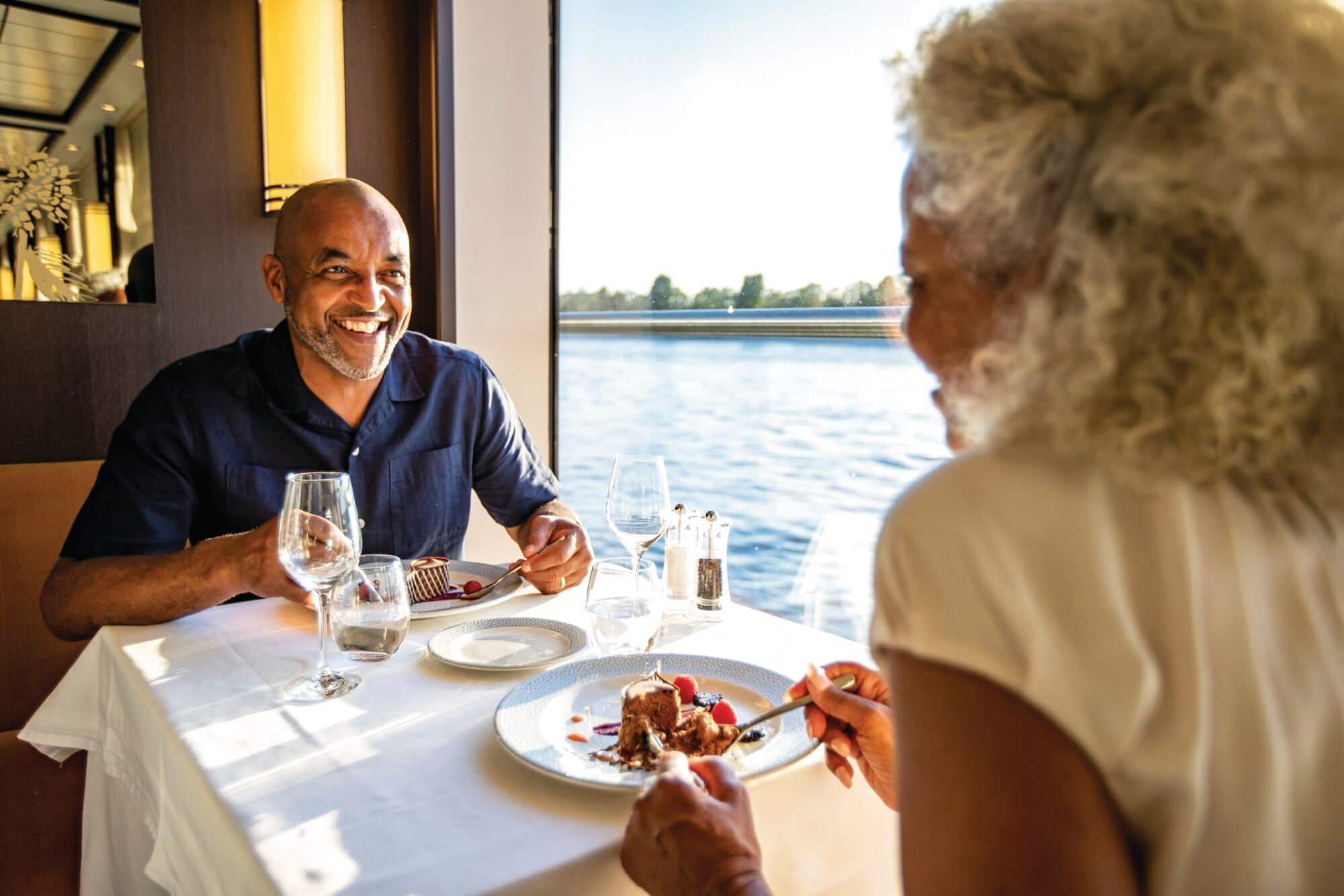 A couple enjoying a meal onboard.