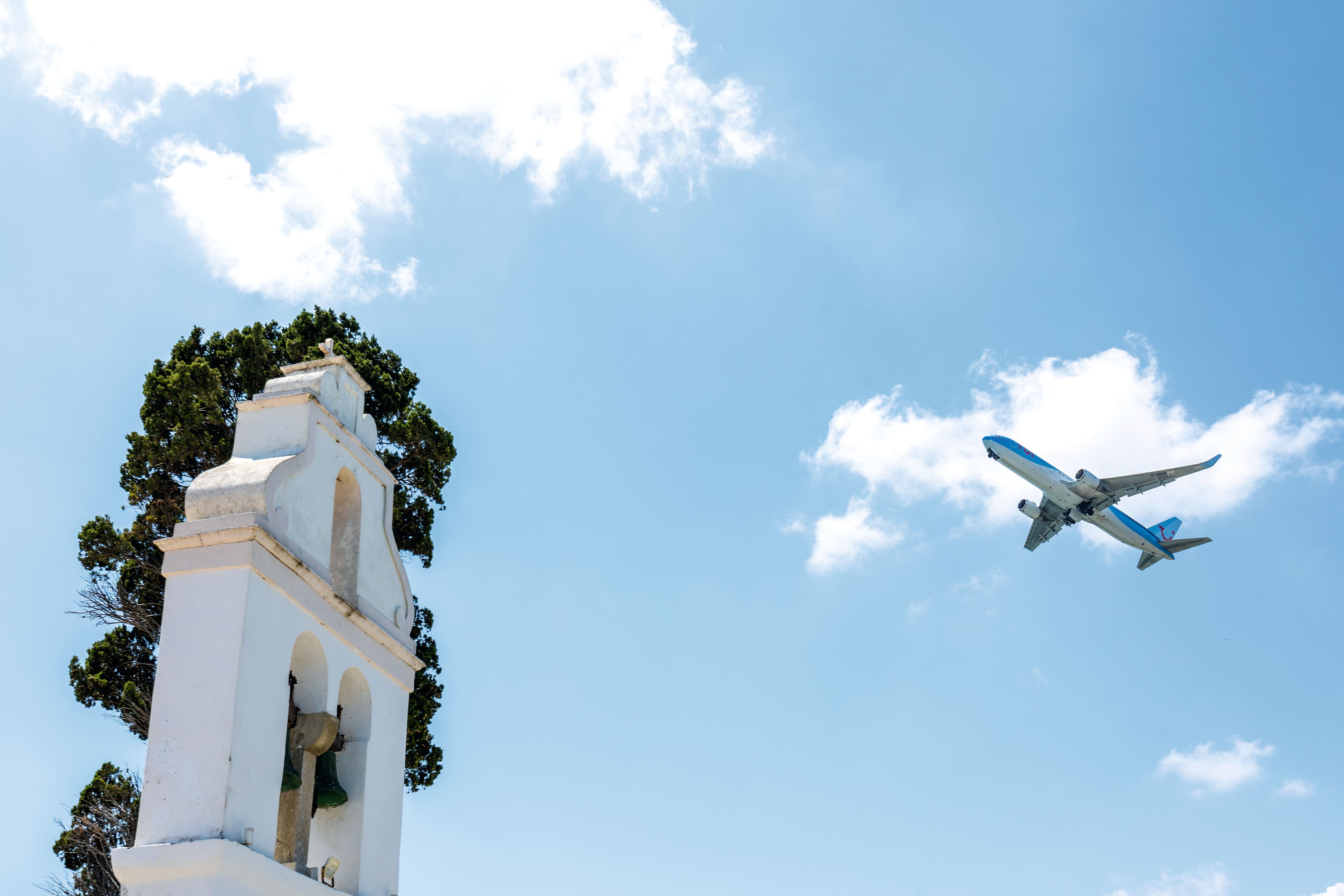 A TUI plane flying over Corfu, Greece.