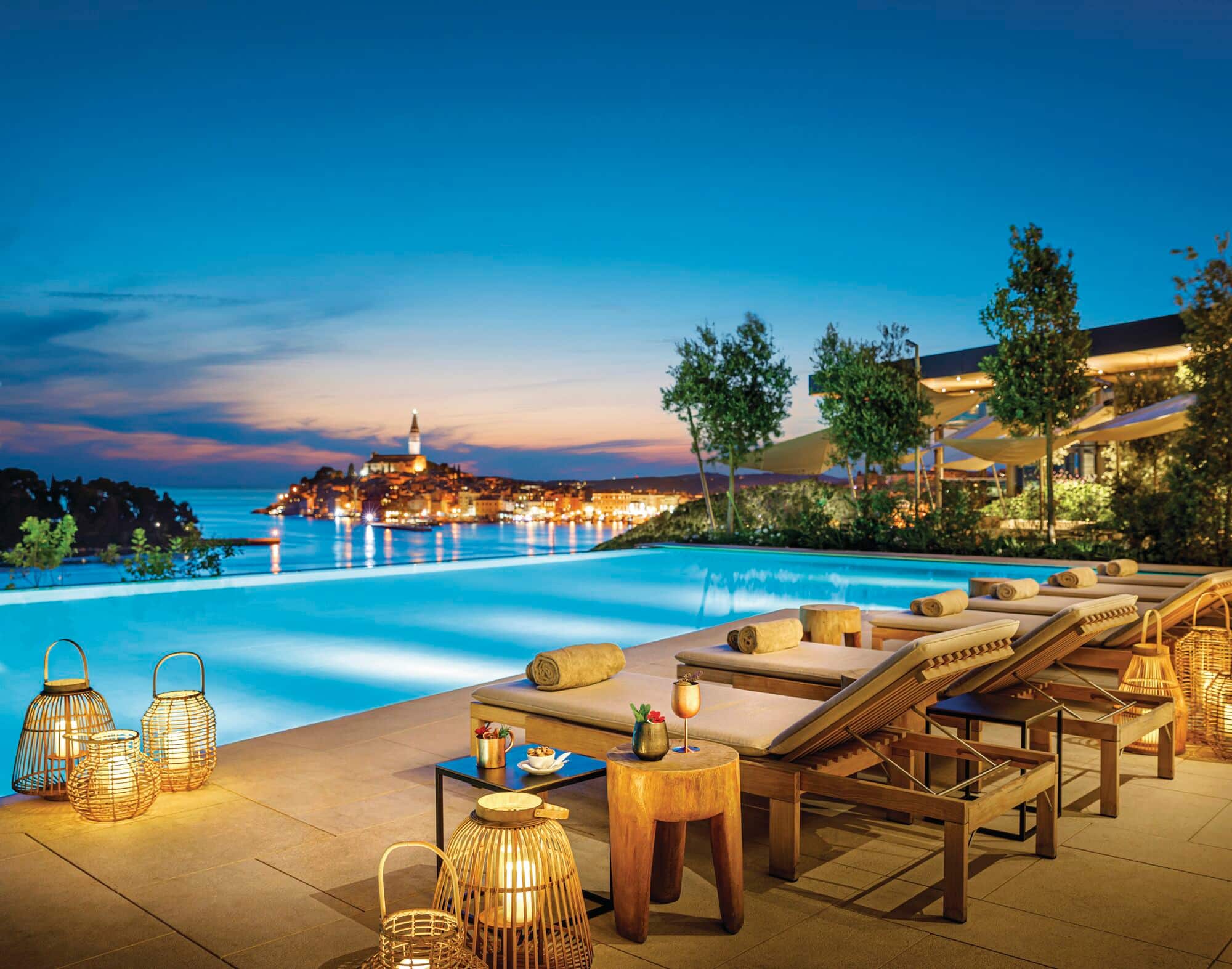 An infinity pool area at night.