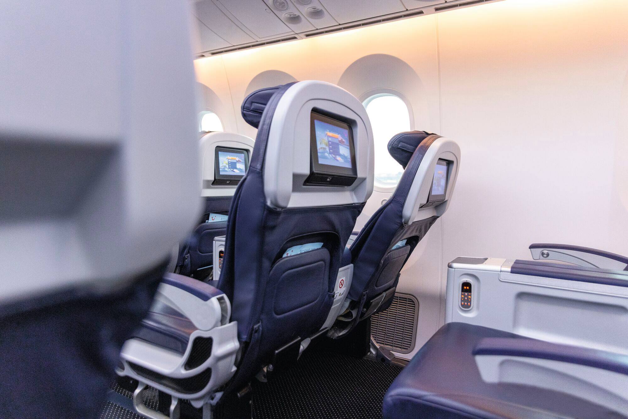 A row of extra space plane seats.