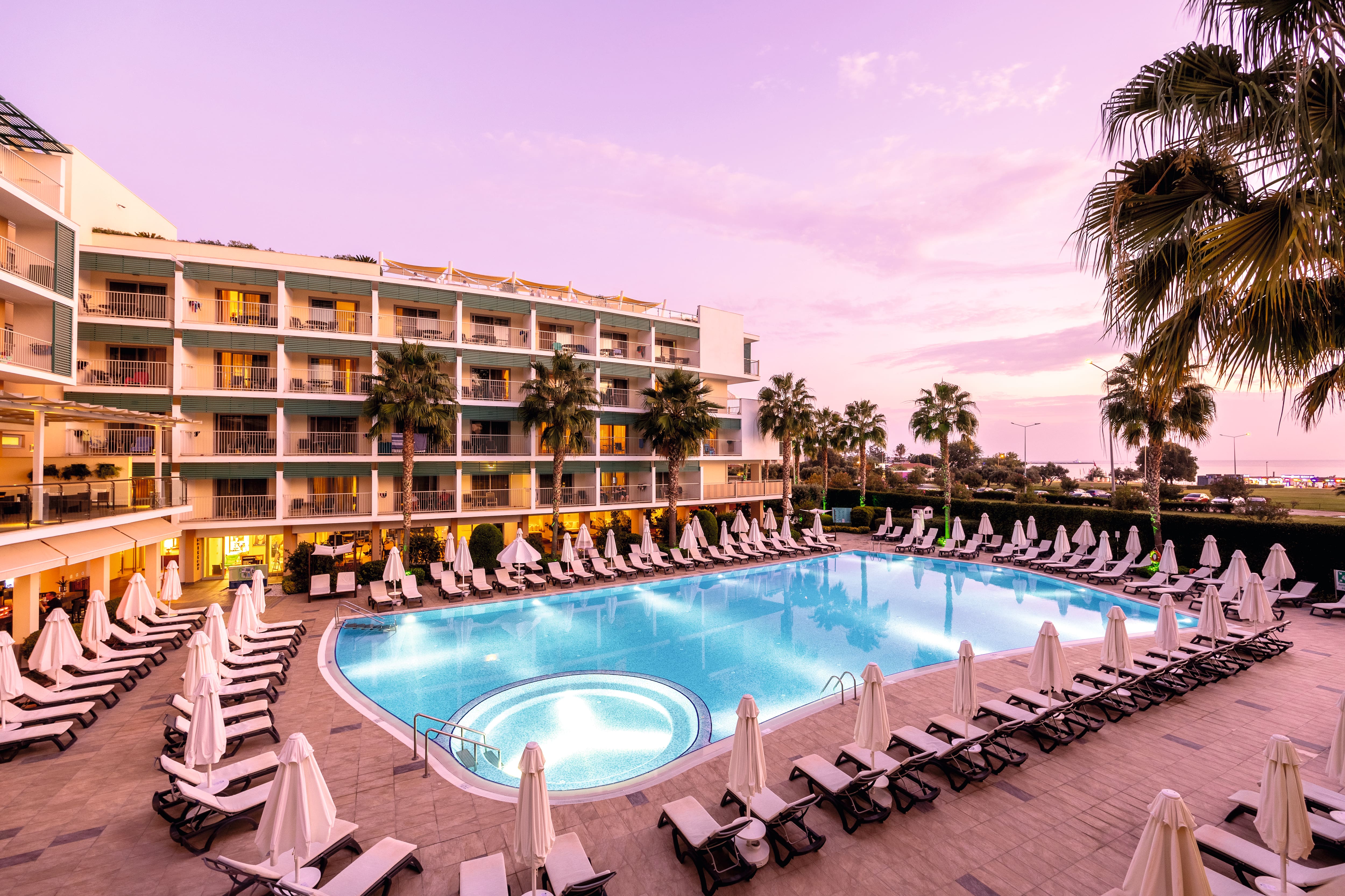 The central pool at TUI BLUE Barut Andiz during sunset.