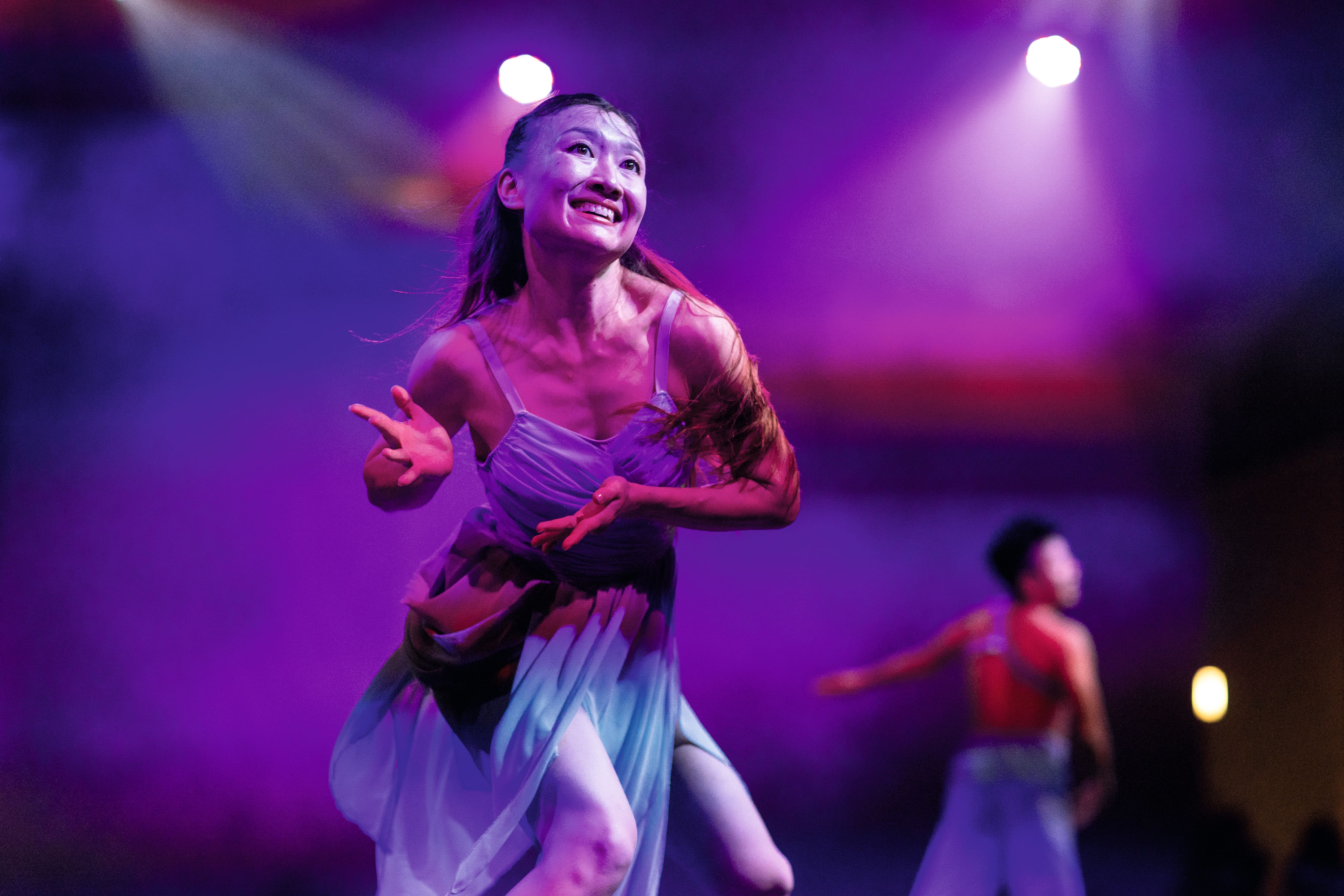 Woman dancing on stage.