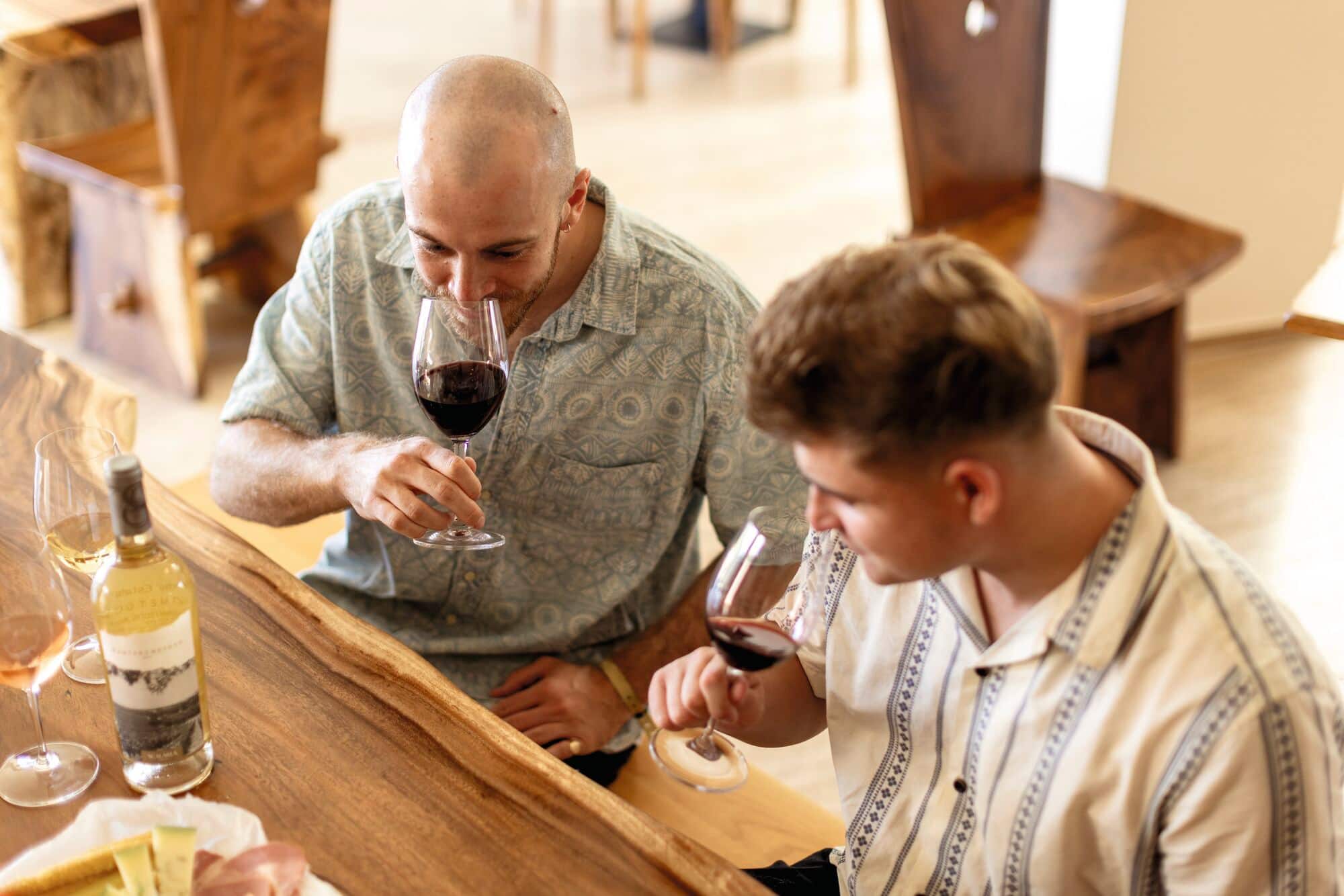 Two friends enjoying a wine tasting experience.