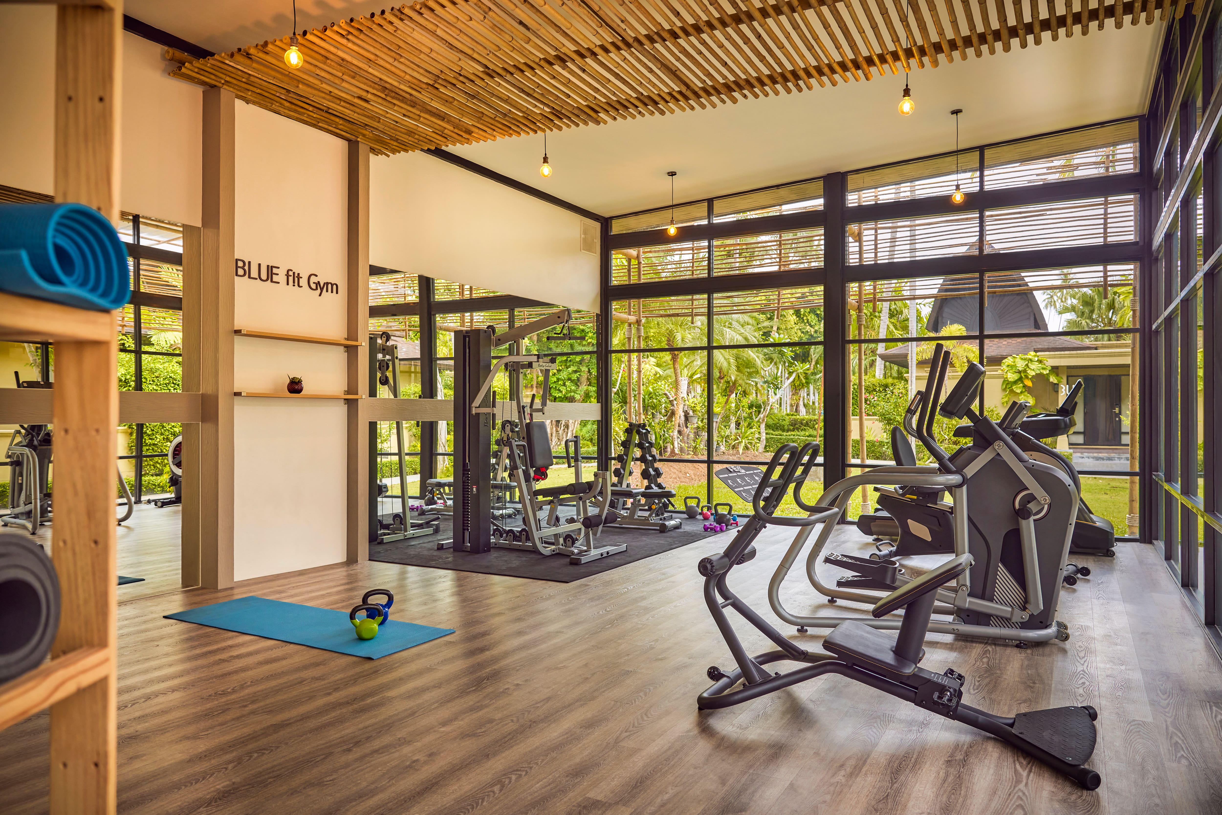 A gym with cardio and weight machines.