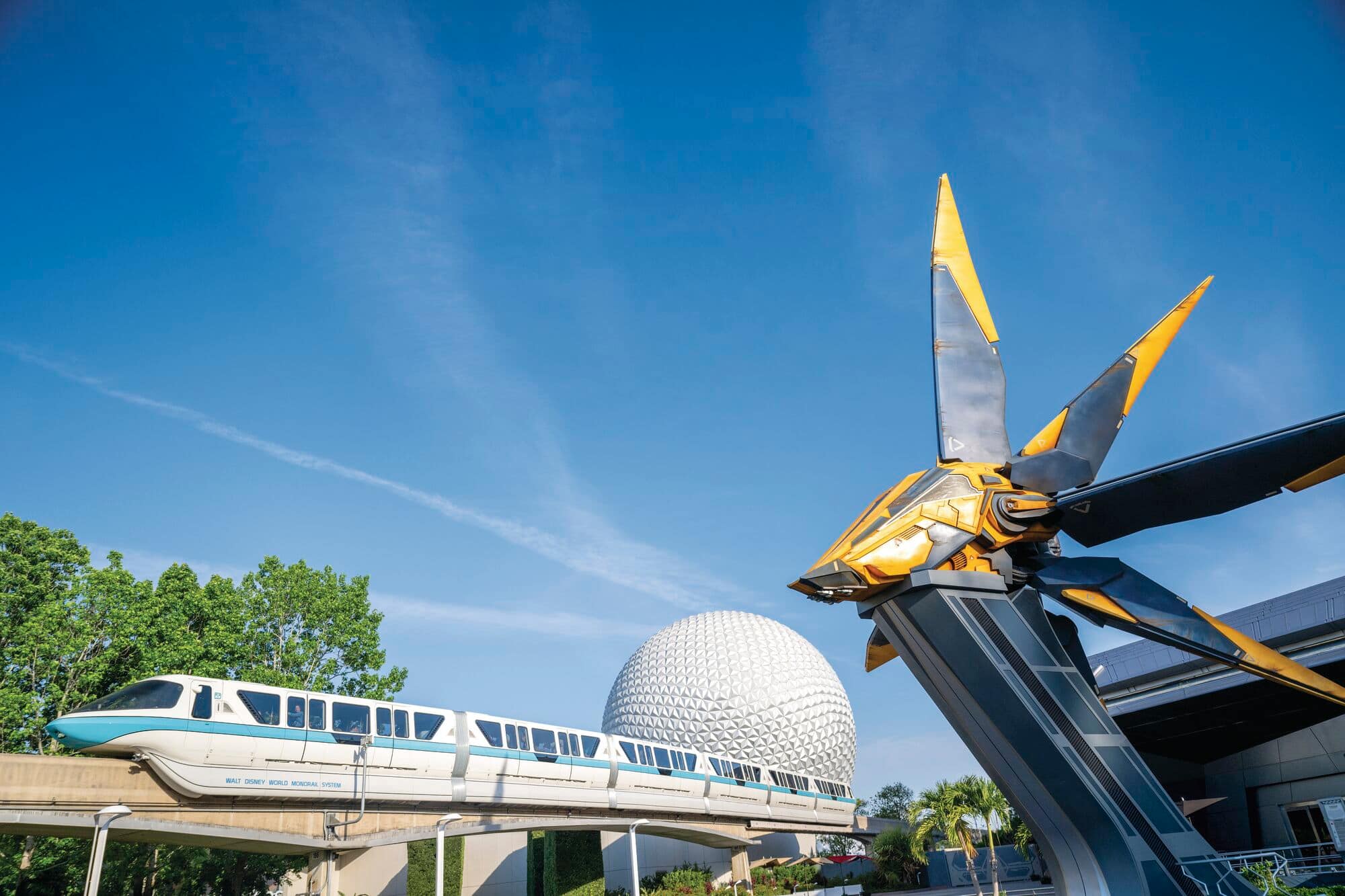 A monorail rides past the Guardians of the Galaxy ride.