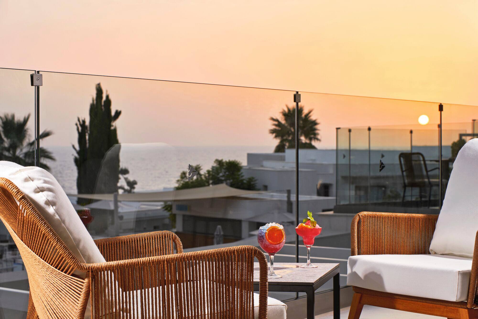 Cocktails on a sea-view rooftop bar.