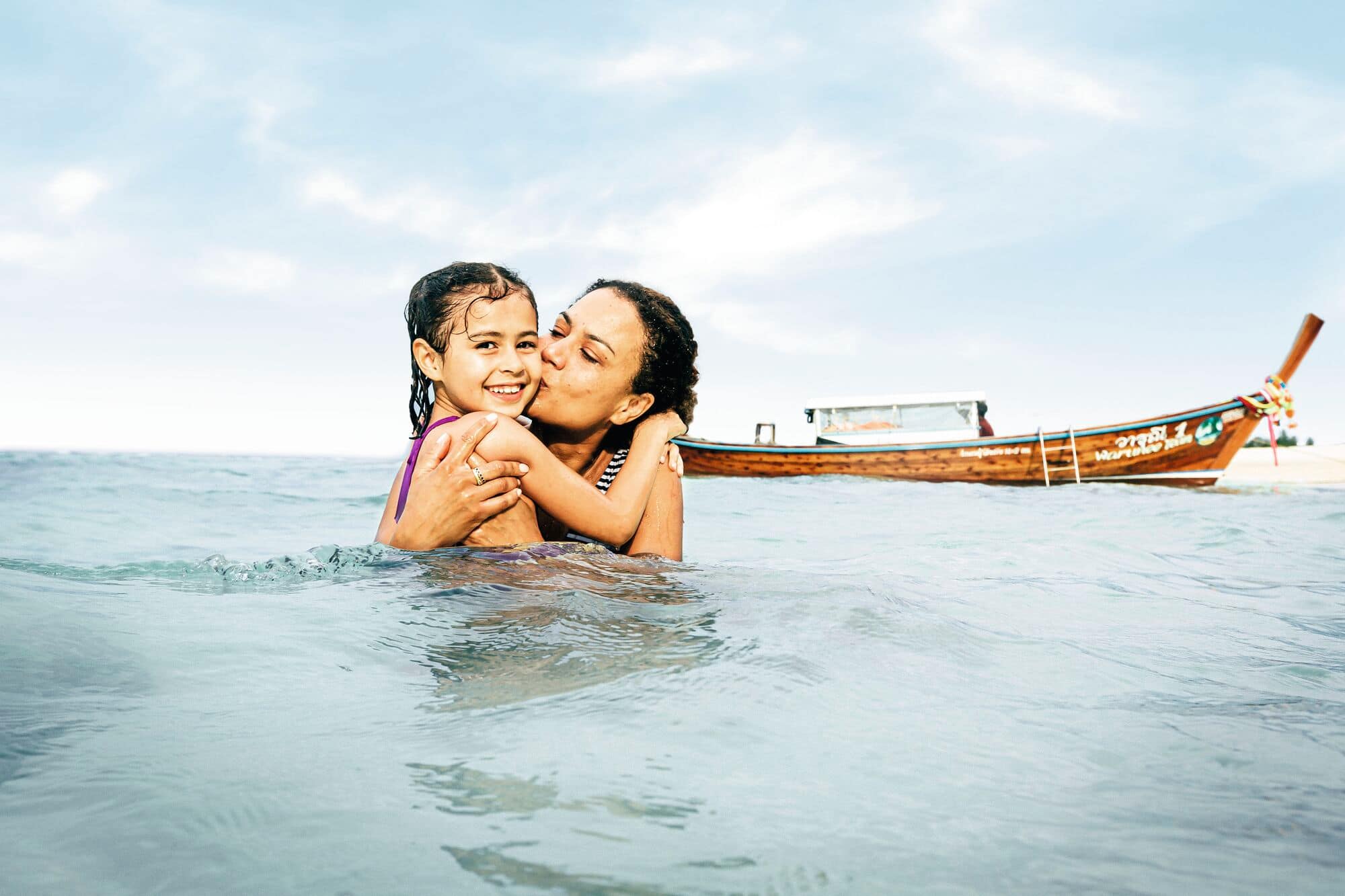 Mother and daughter in the sea in Thailand.