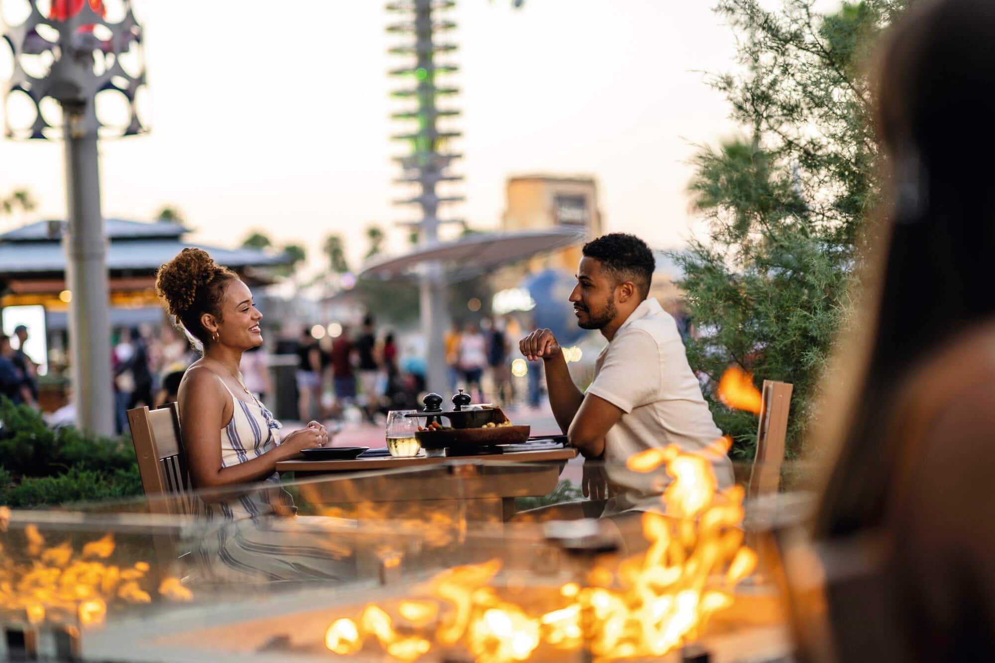 A couple enjoying a meal at Big Fire restaurant.