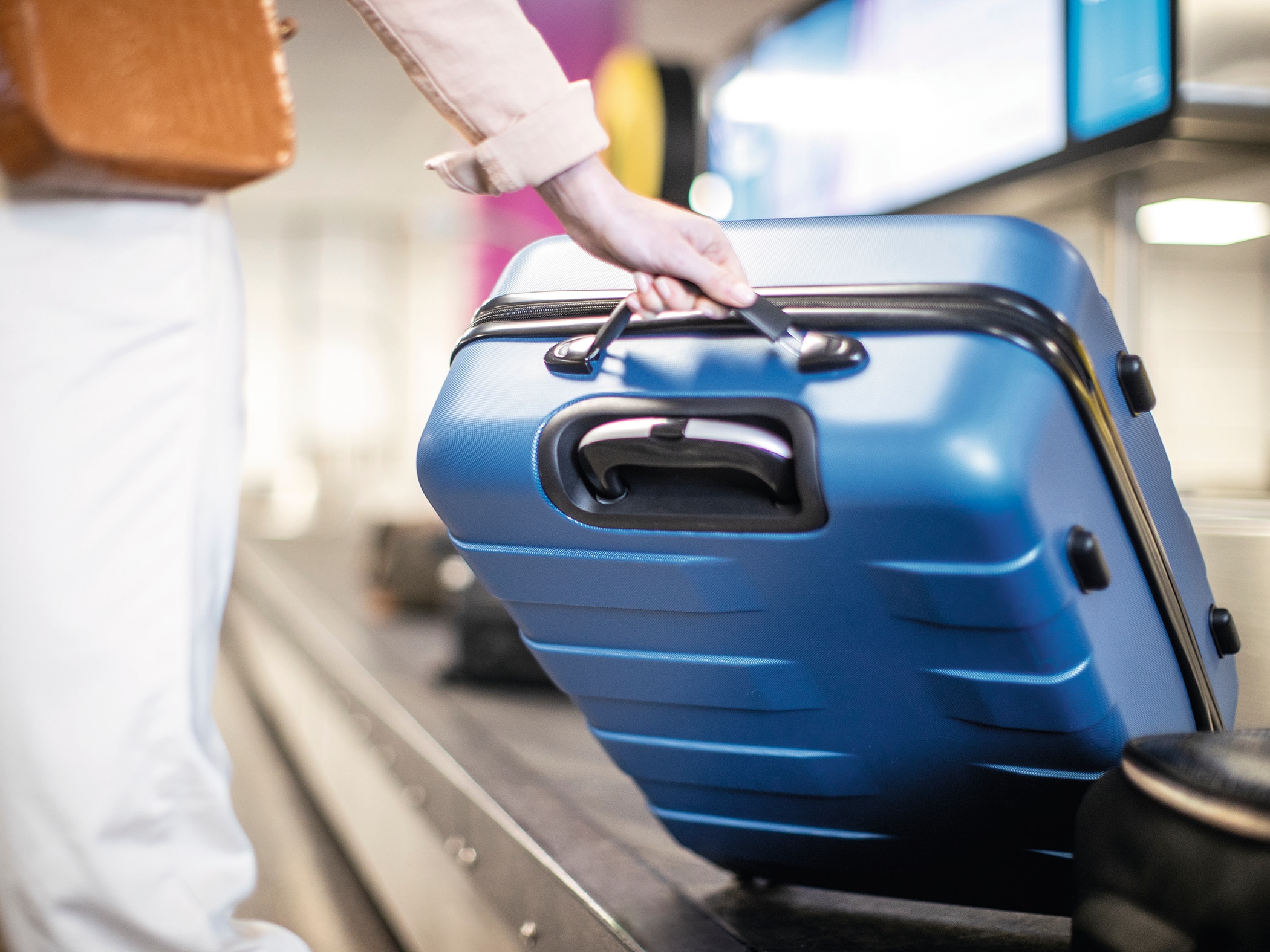 A close-up of a blue suitcase.