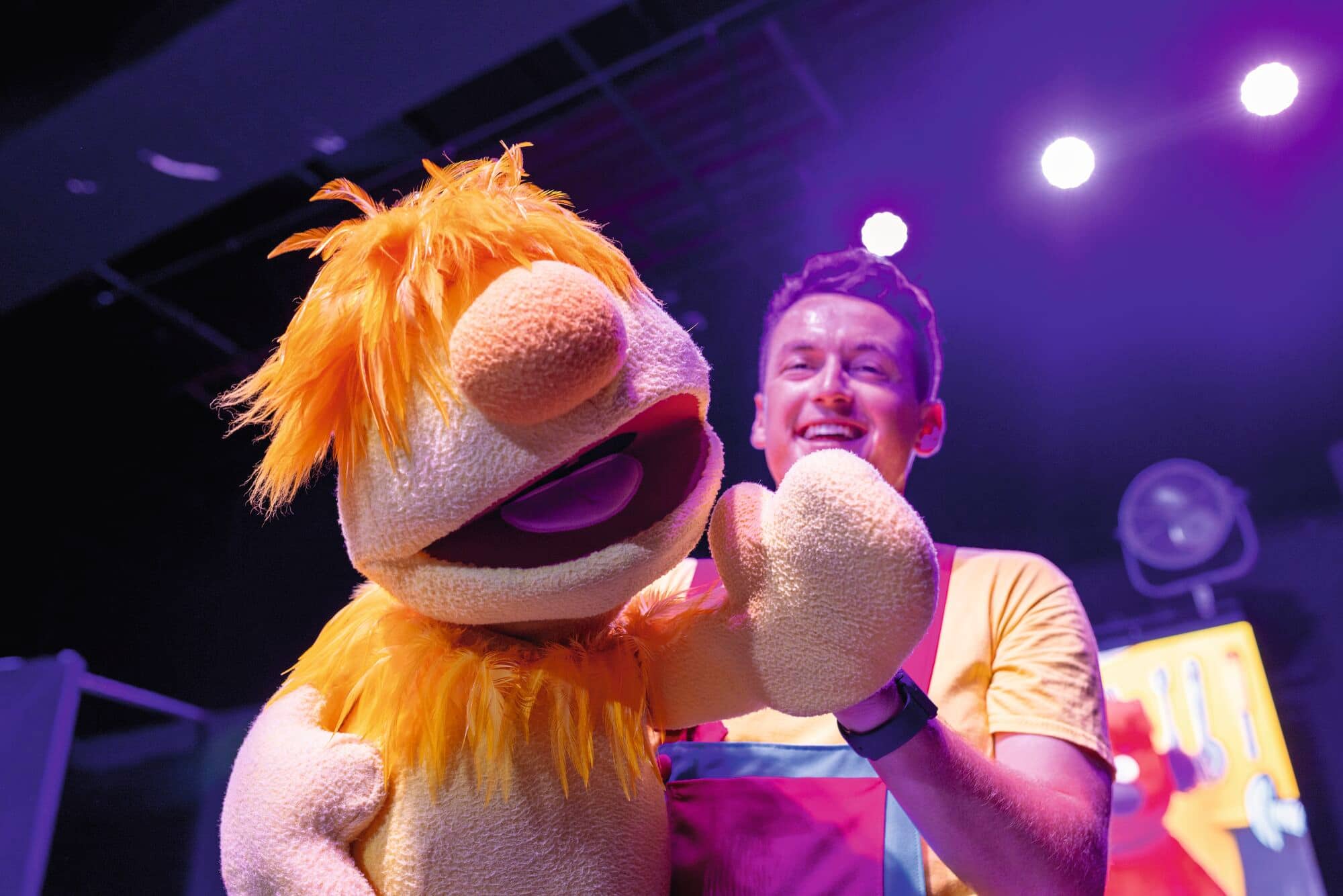 A performer with a puppet.