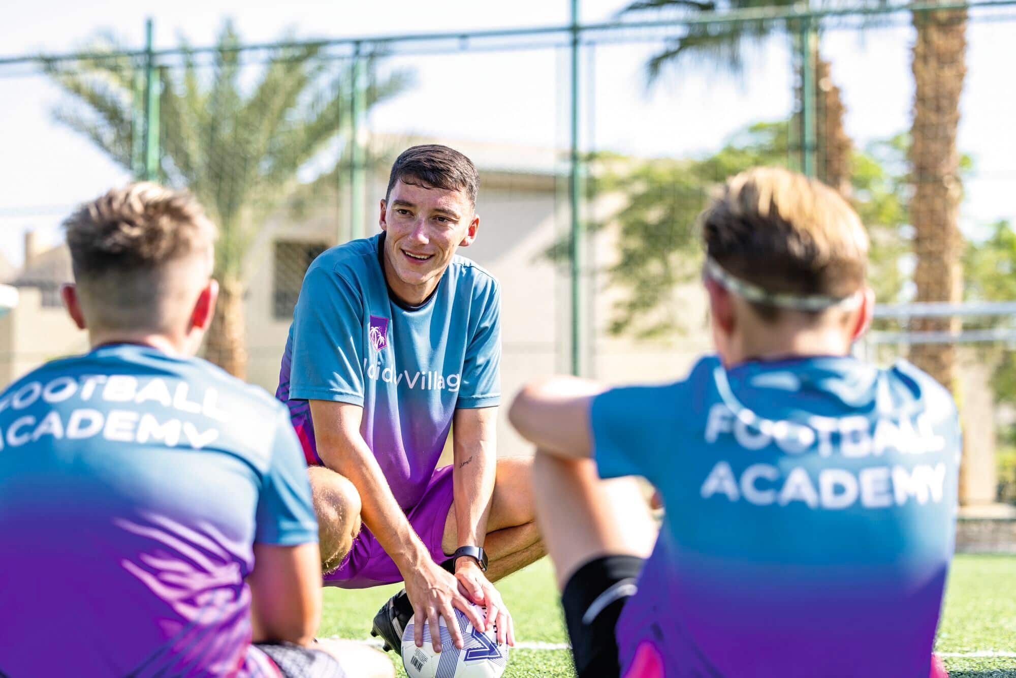 Children learning football at the Academies for tots to teens.