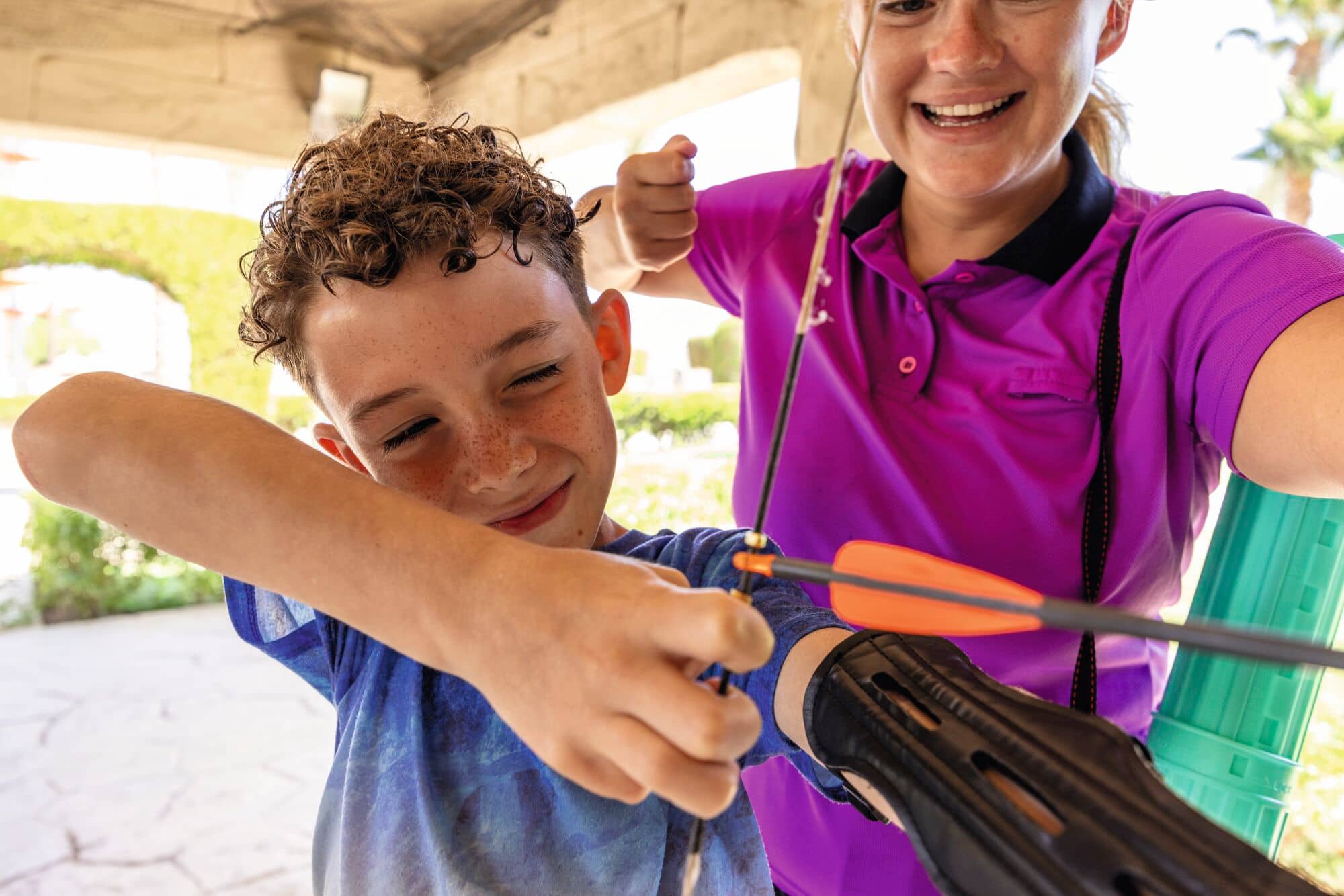 A boy playing archery.