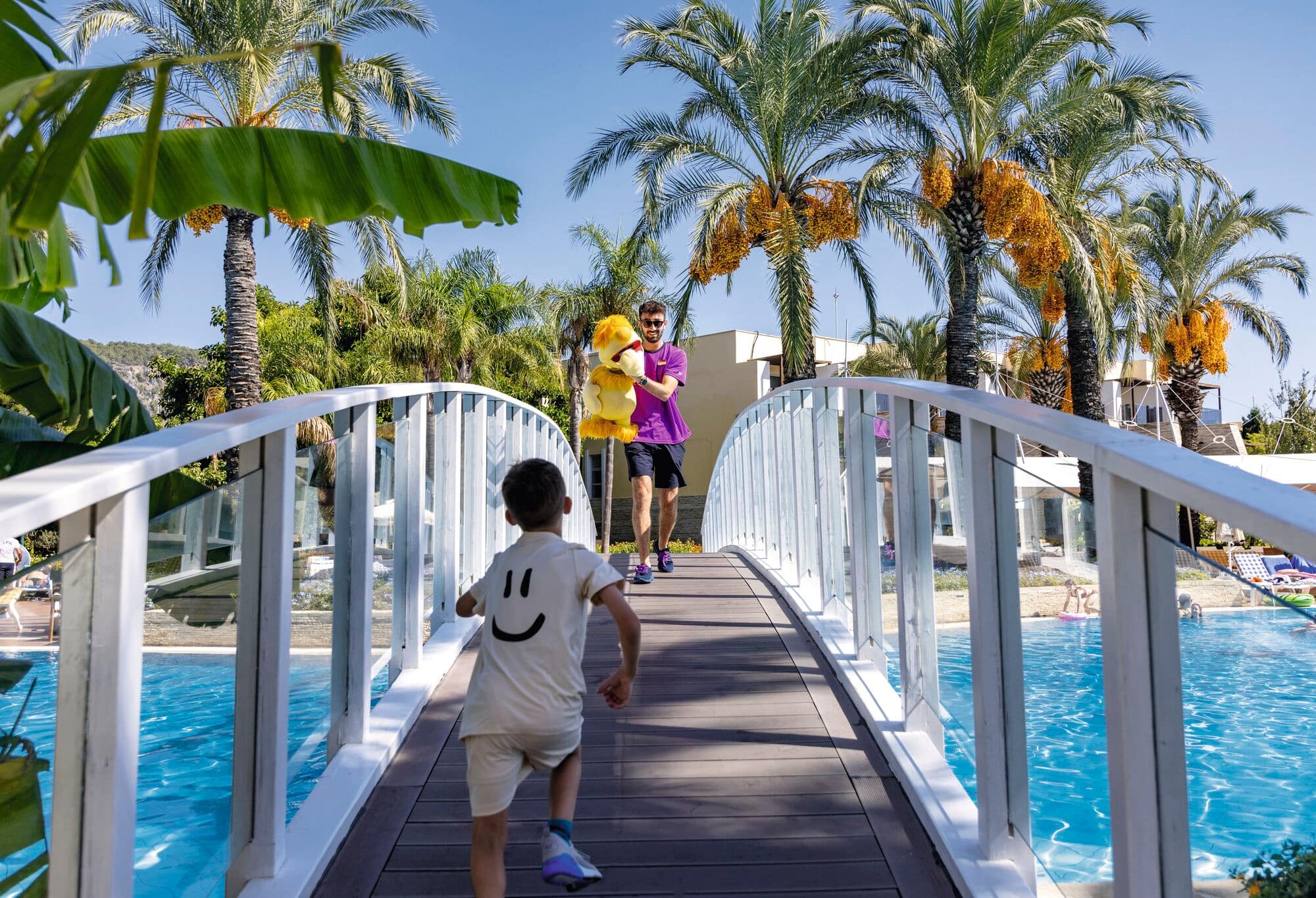 A child playing near the pool.