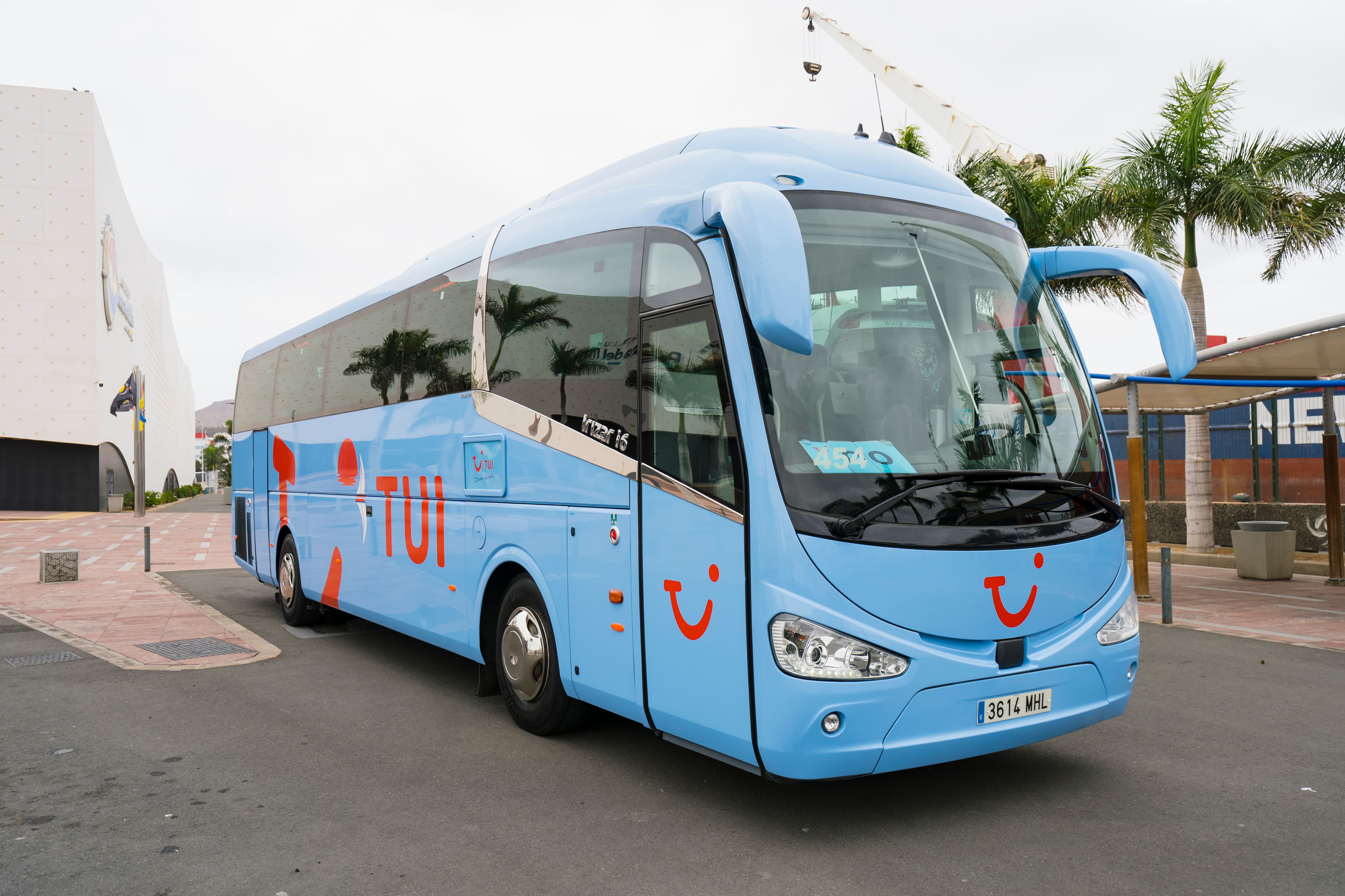 A blue TUI coach.