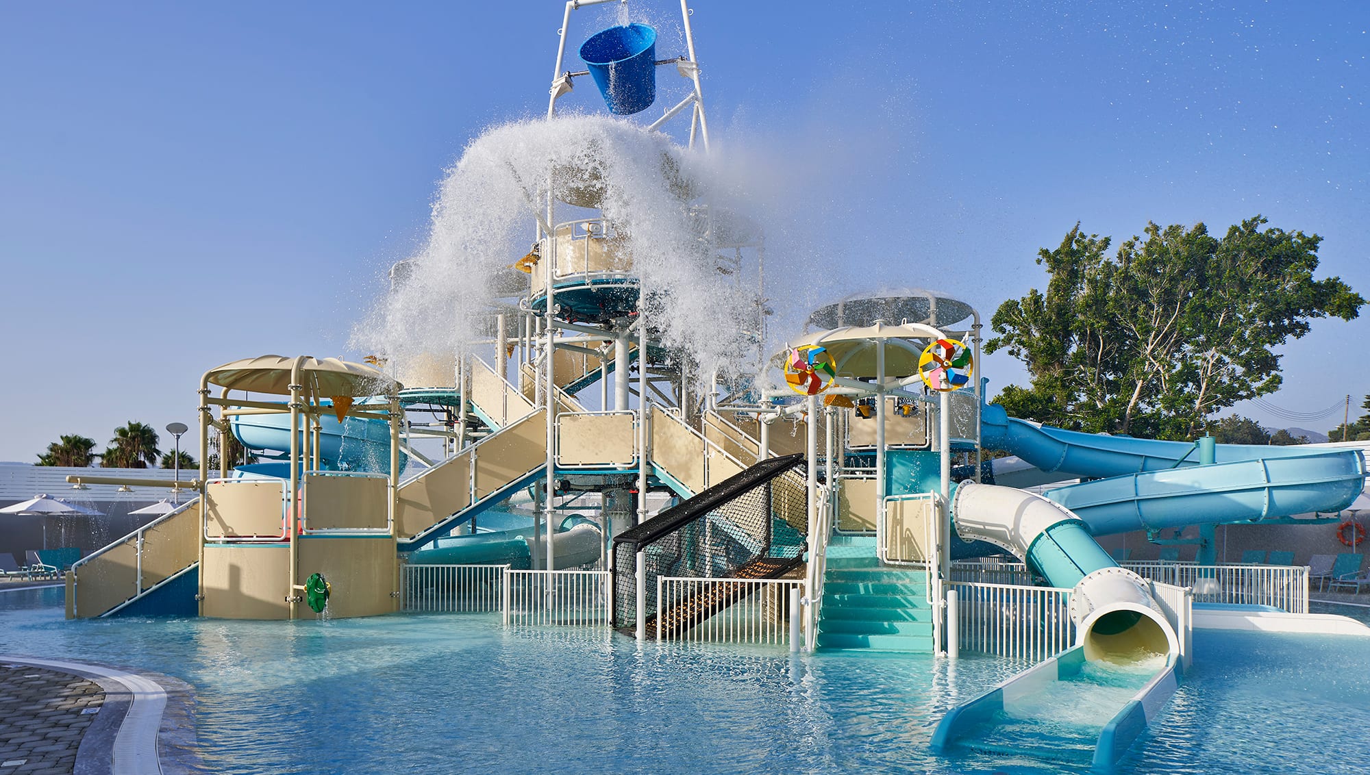 A splash park with a big tipping bucket.