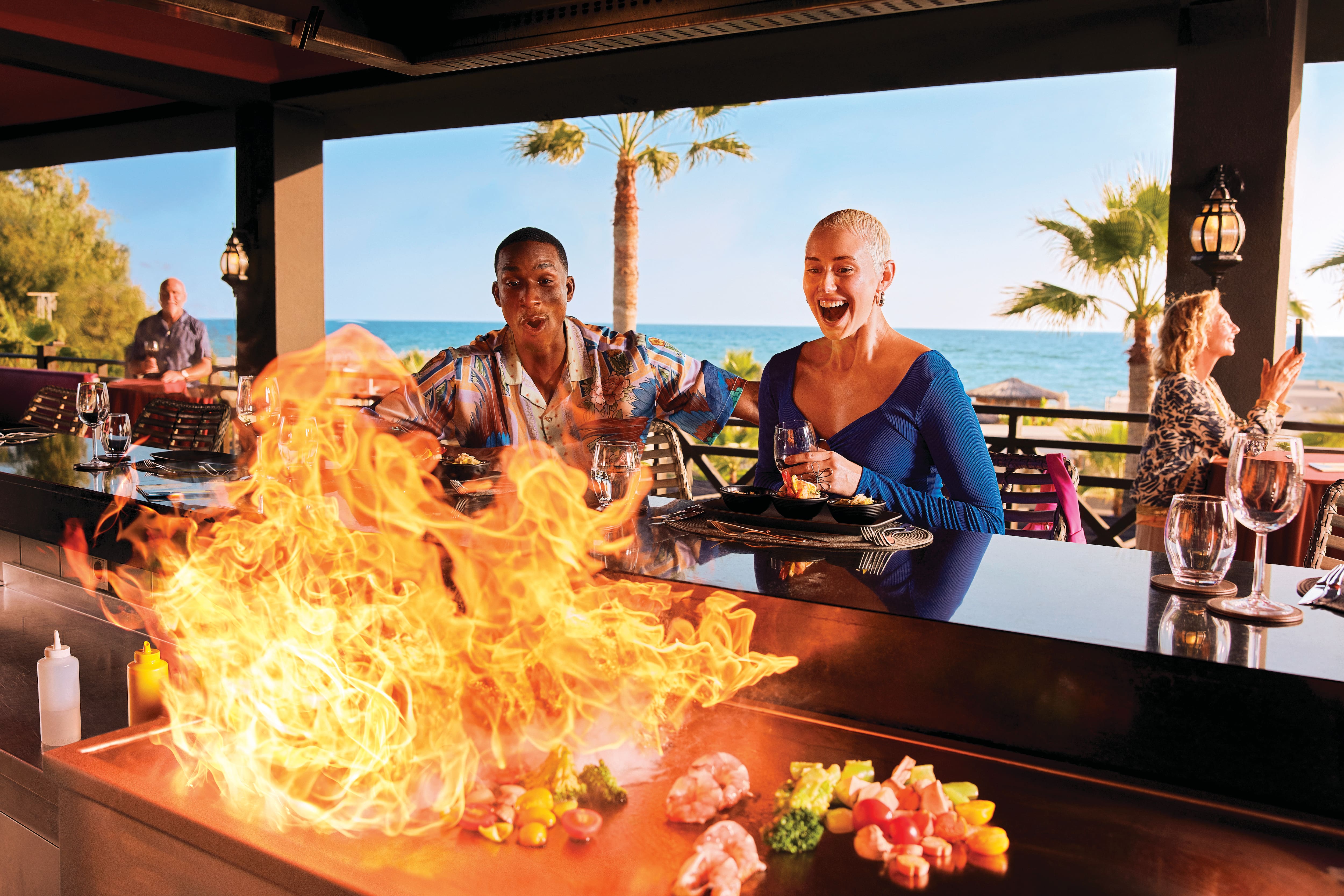 Two people at the All inclusive BBQ at a TUI Magic life hotel.