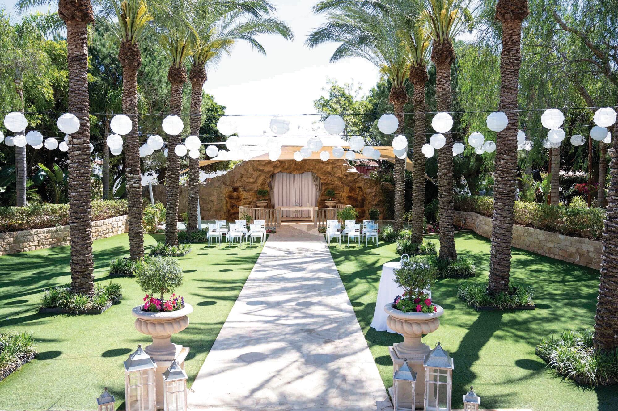 An intimate wedding ceremony set-up across the hotel’s palm-lined lawn. 