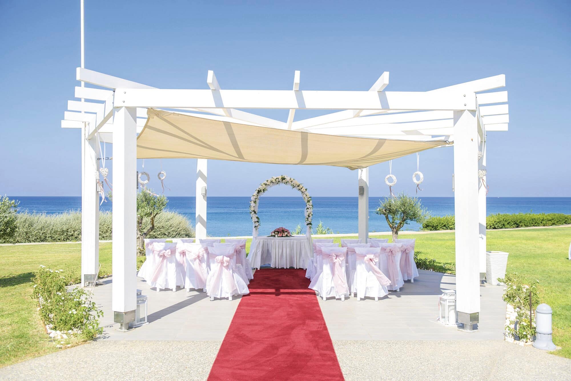 A view of a wedding pavilion by the sea at Pernera Beach Hotel in Cyprus.