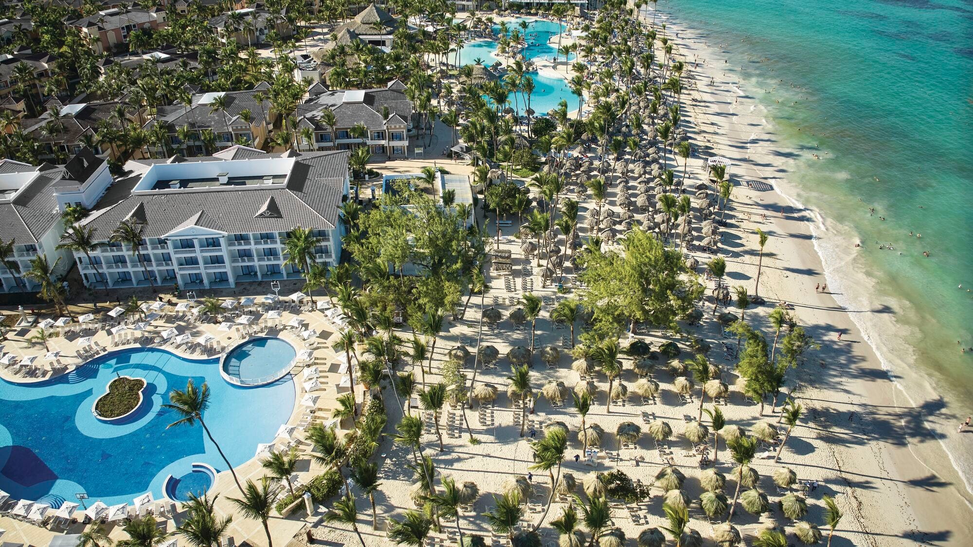 The pool and surrounding sea at Bahia Principe Explore Esmeralda.