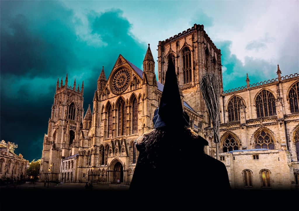 A person wearing a Witches hat in York.