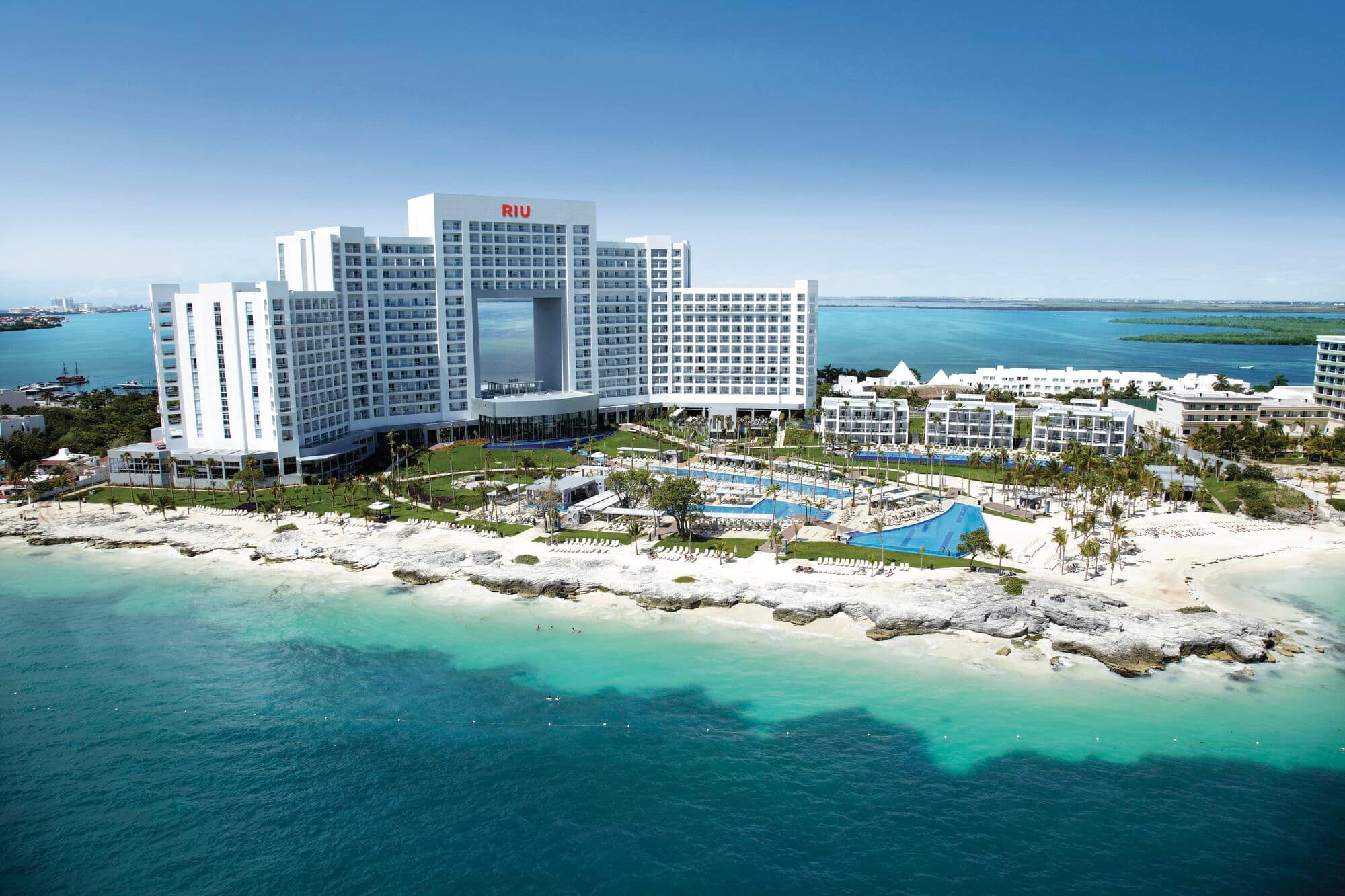 Aerial view of beachfront hotel.