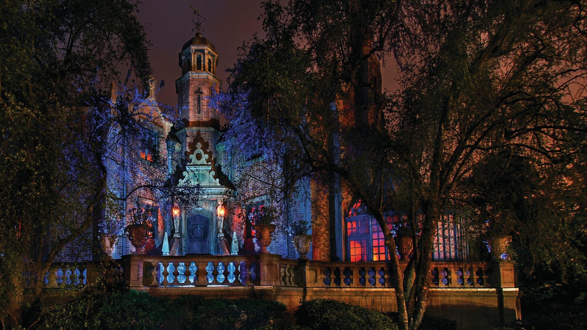 The Haunted Mansion at night.