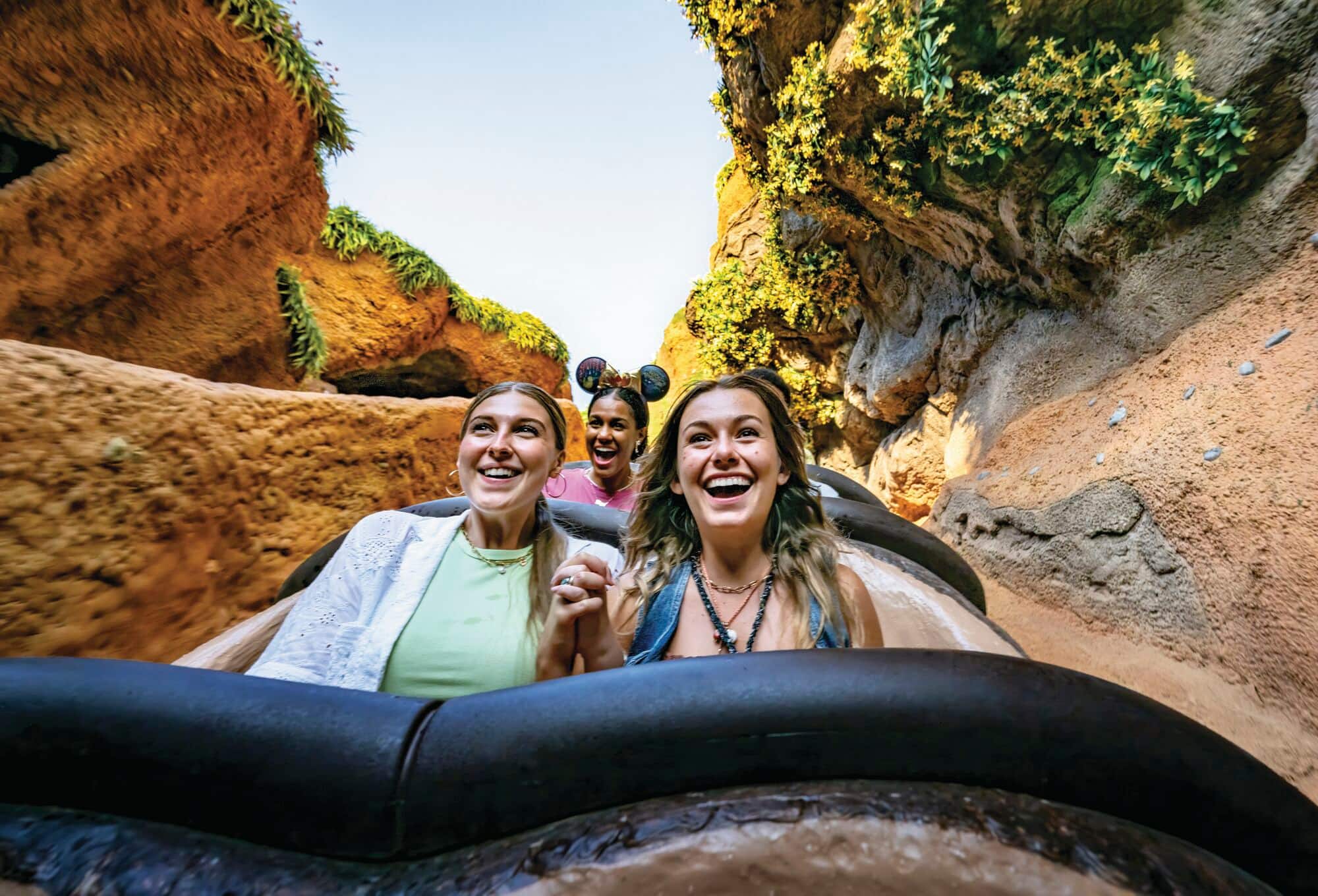 A family on a water ride in Frontierland.