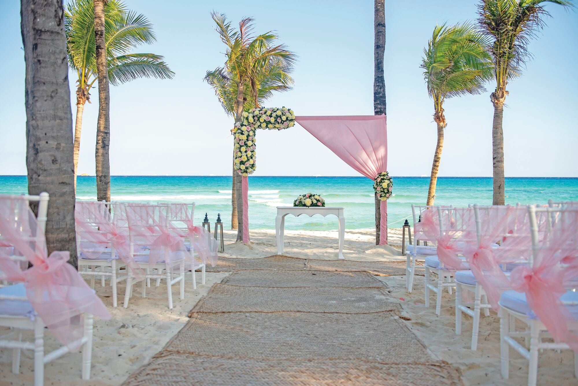 A beach wedding ceremony set-up at Riu Palace Riviera Maya Hotel in Mexico.