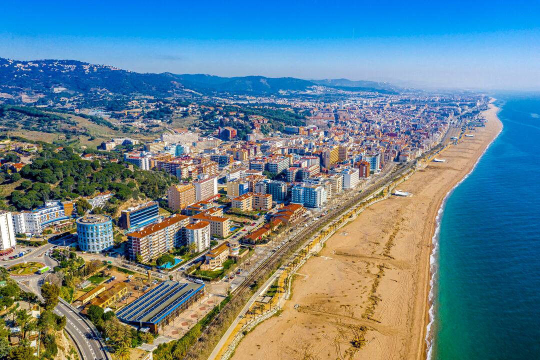 The town of Calella and its sandy beach