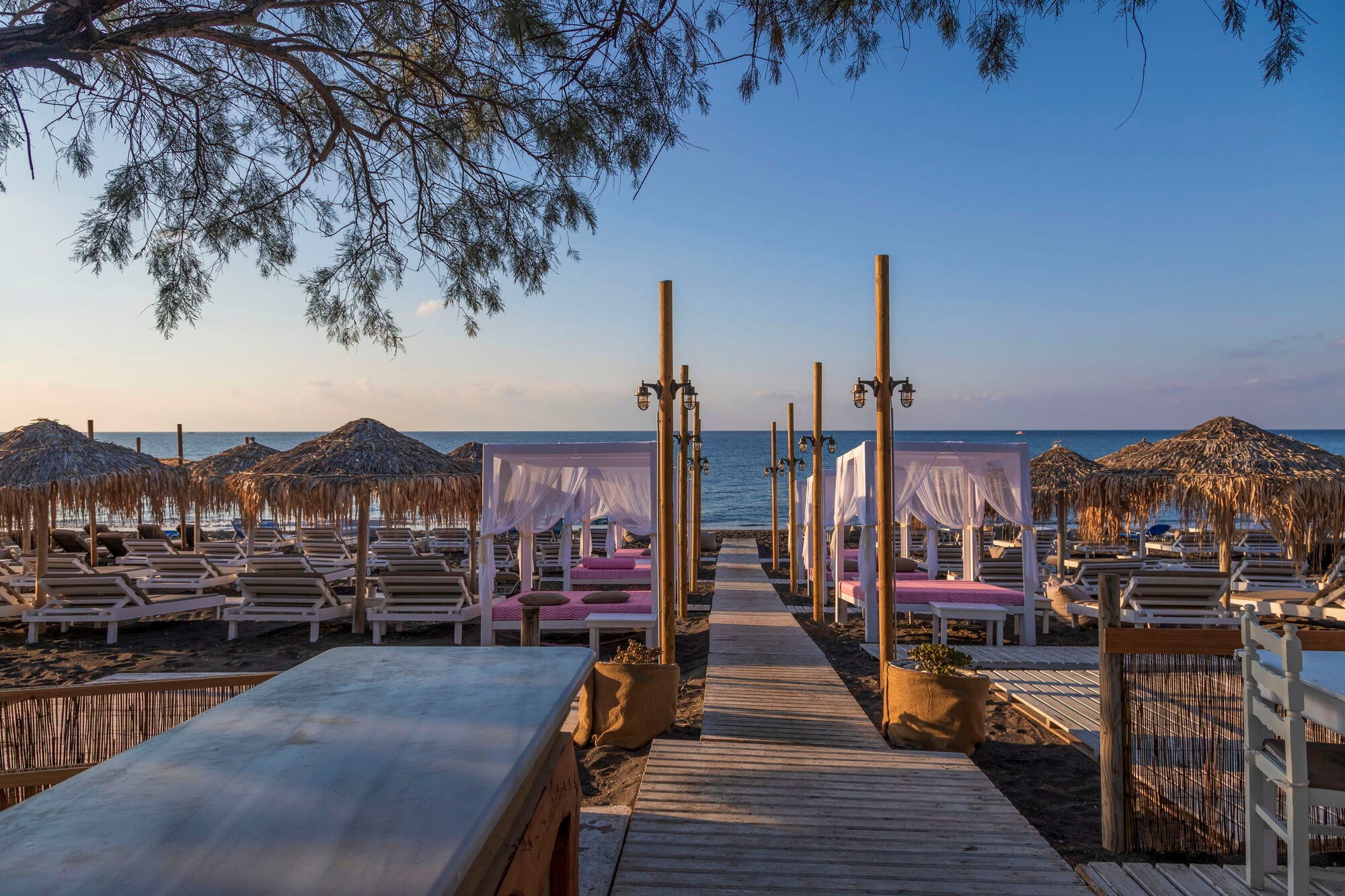 Sunloungers at sunset, Perivolos, Santorini