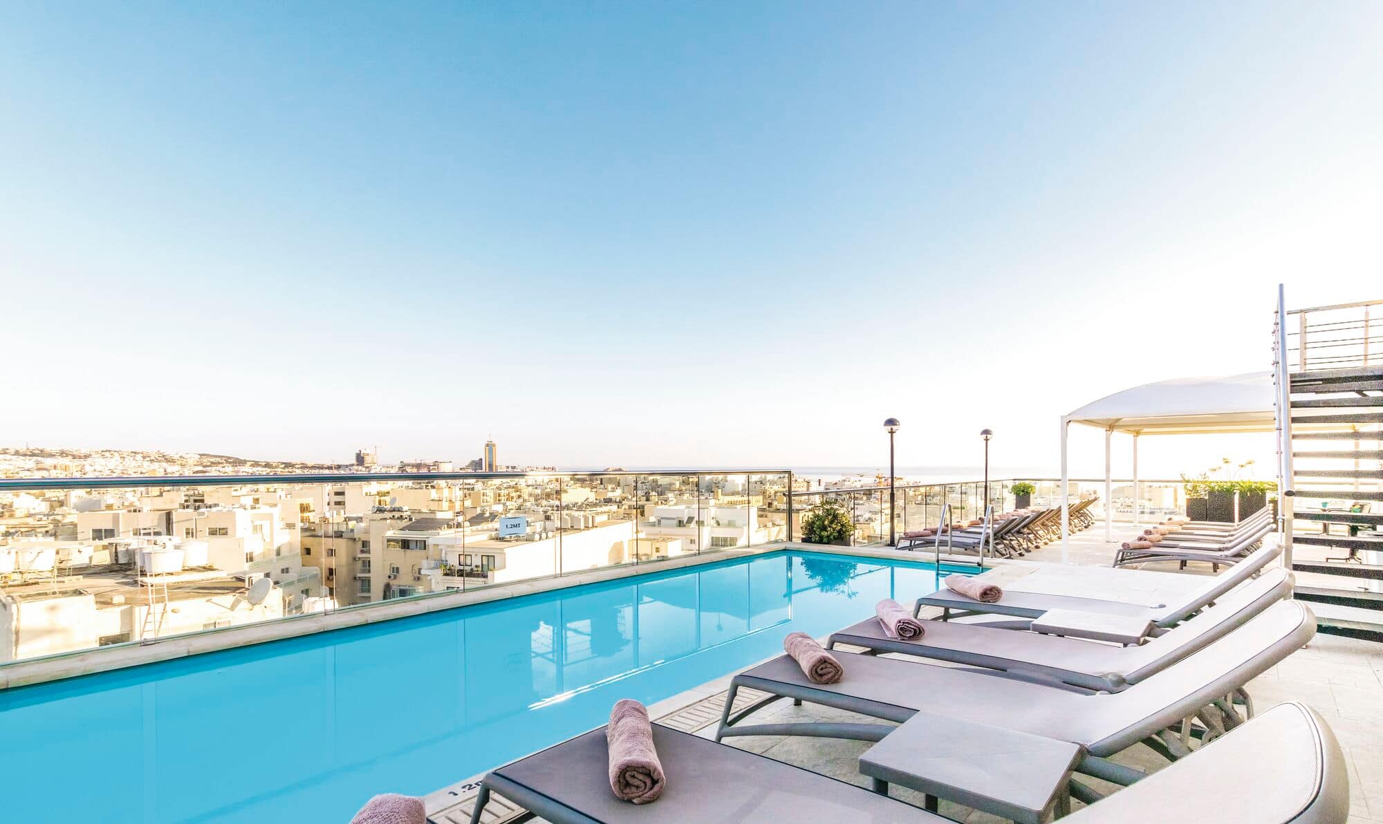 A rooftop pool at AX The Victoria.