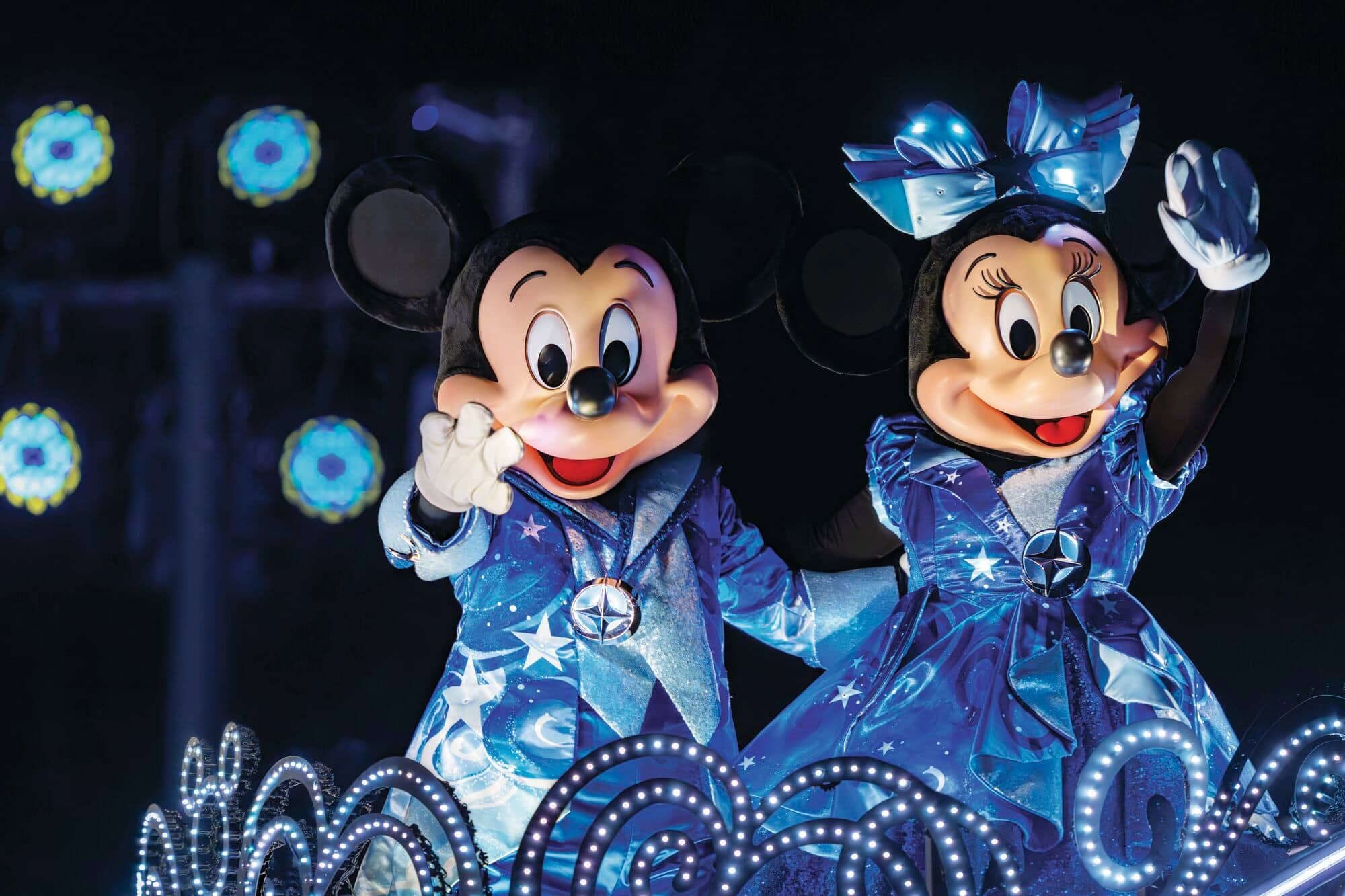 Mickey and Minnie waving.