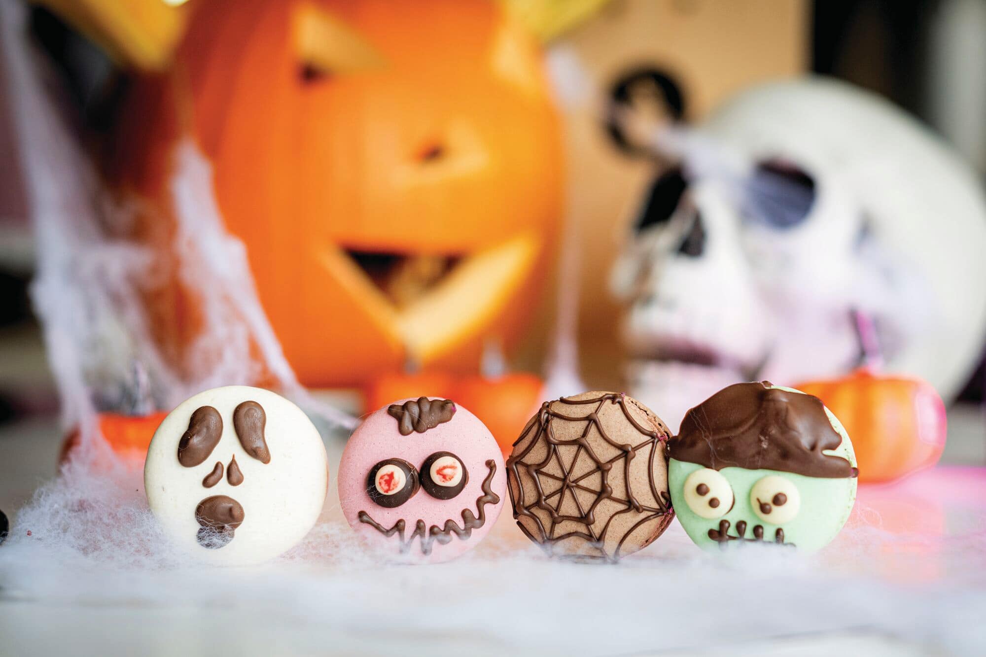 Halloween decorated biscuits with a spooky themed background.