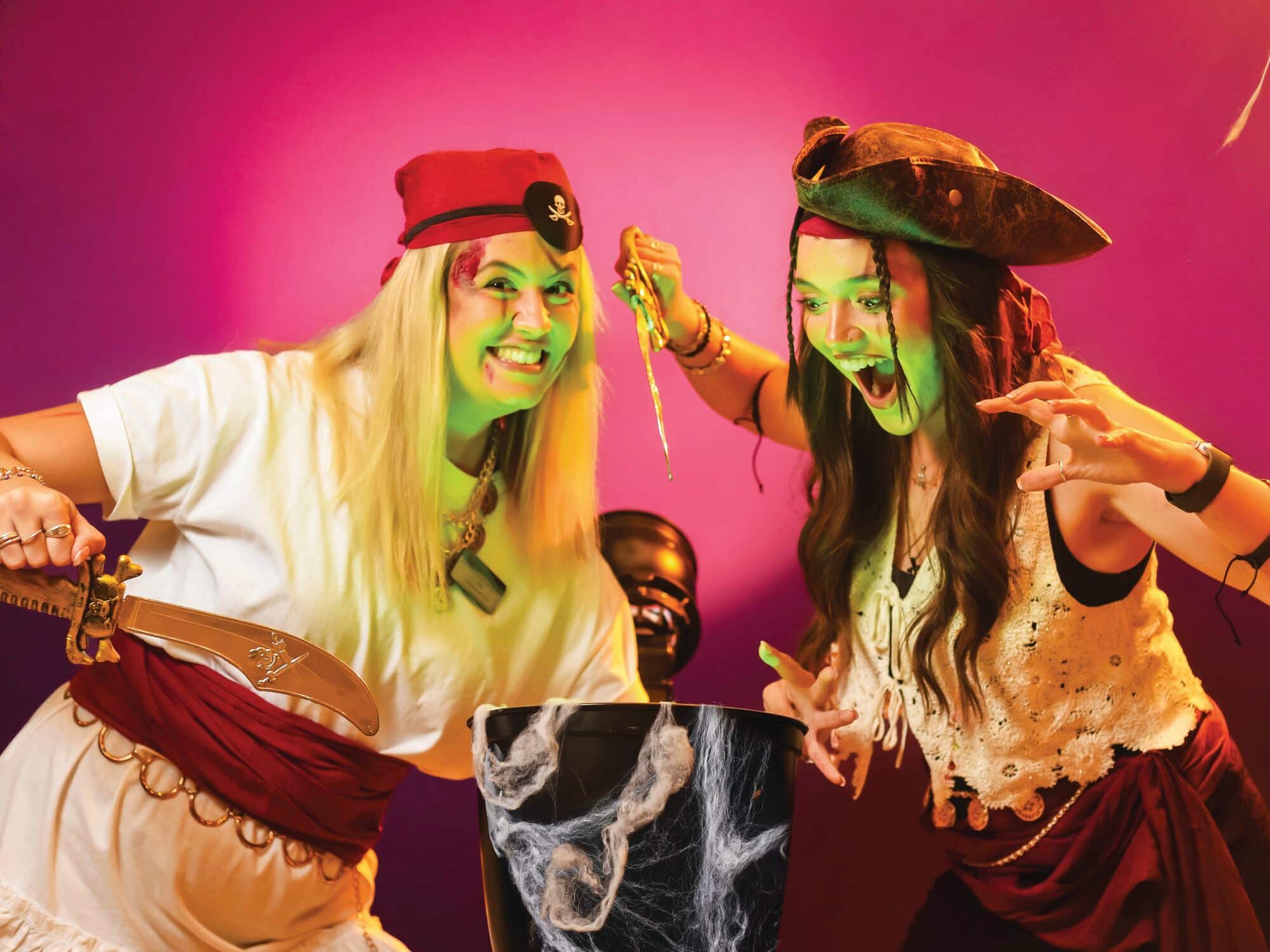 Two people dressed up in pirate costumes.