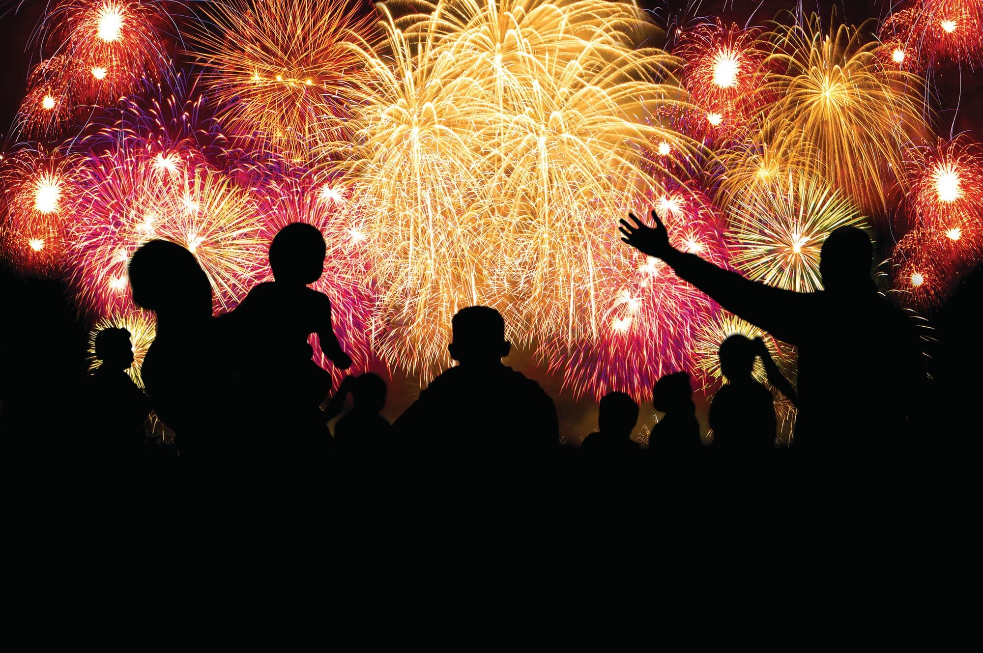 Colourful fireworks lighting up the night sky during a local celebration.