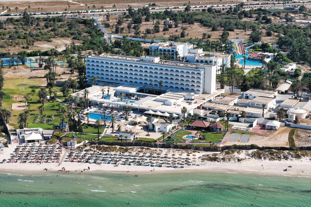 An aerial view of the hotel and beachfront